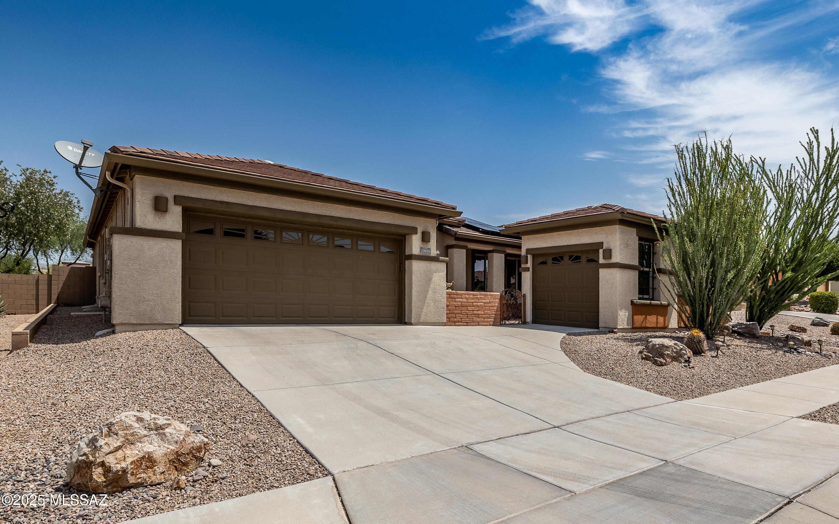 Gorgeous Home in Del Webb Four Seasons Phase 1 - 55+ Resort-Style Living! Welcome to your dream home in the sought-after Del Webb community at Four Seasons Phase 1—a premier 55+ neighborhood offering world-class amenities and an active, resort-style lifestyle! Built in 2010, this stunning 3-bedroom, 2.5-bath home offers 2,359 square feet of well-designed living space, plus an enclosed sunroom, front courtyard, and inviting back patio. Step inside to discover: 9' ceilings and a light, open floor plan, elegant granite countertops, No carpet—easy-care flooring throughout, Plantation shutters on nearly every window, Flexible 3rd bedroom with built-in wall unit and walk-in closet perfect as a den, office, or guest room. The spacious Owner's Suite features a charming bay window & walk in tub Plus large walk-in closet, walk-in therapeutic tub, separate shower, and dual vanities. Your guests will enjoy a full bath and convenient half bath. The oversized garage includes a separate golf cart garage, complete with workbench and custom-built cabinetry a dream for any hobbyist or DIYer. Enjoy Catalina Mountain views from your Arizona Room, which features a power retractable screen and opens onto a low-maintenance backyard with artificial turf. Even better this home comes with owned solar, offering you minimal to no electric bills year-round!