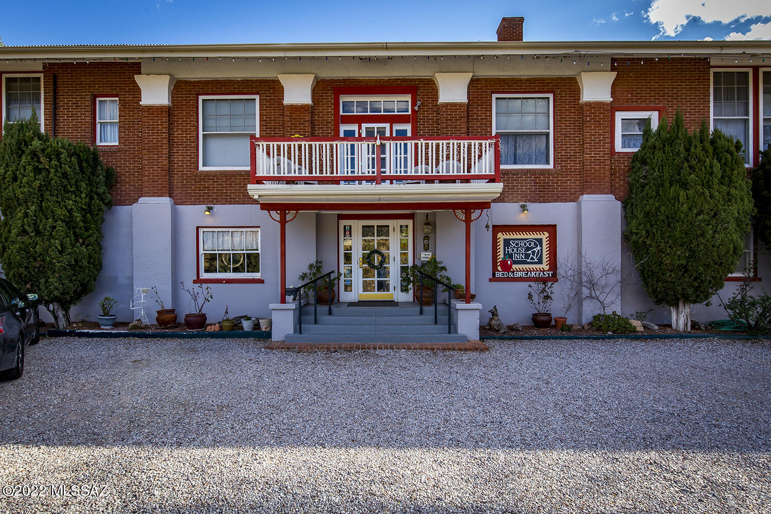 Buyer will accept backup offer! 
This sweet B&B in Old Bisbee, originally the Garfield School, is now The School House Inn. A historic building of solid brick construction & metal roof contains 10 bdrms/13 baths plus an Owner's Suite. All units have 12' ceilings & private baths. Building features original woodwork detailing; a large dining room opening onto a tranquil oak-shaded patio with and sitting areas to enjoy the views & breezes; kitchen; walk-in pantry; laundry; workshop; storage; central heat & plenty of deeded parking. There's a front balcony with panoramic views. R3 zoning allows multi-family units, or this could become your dream home!