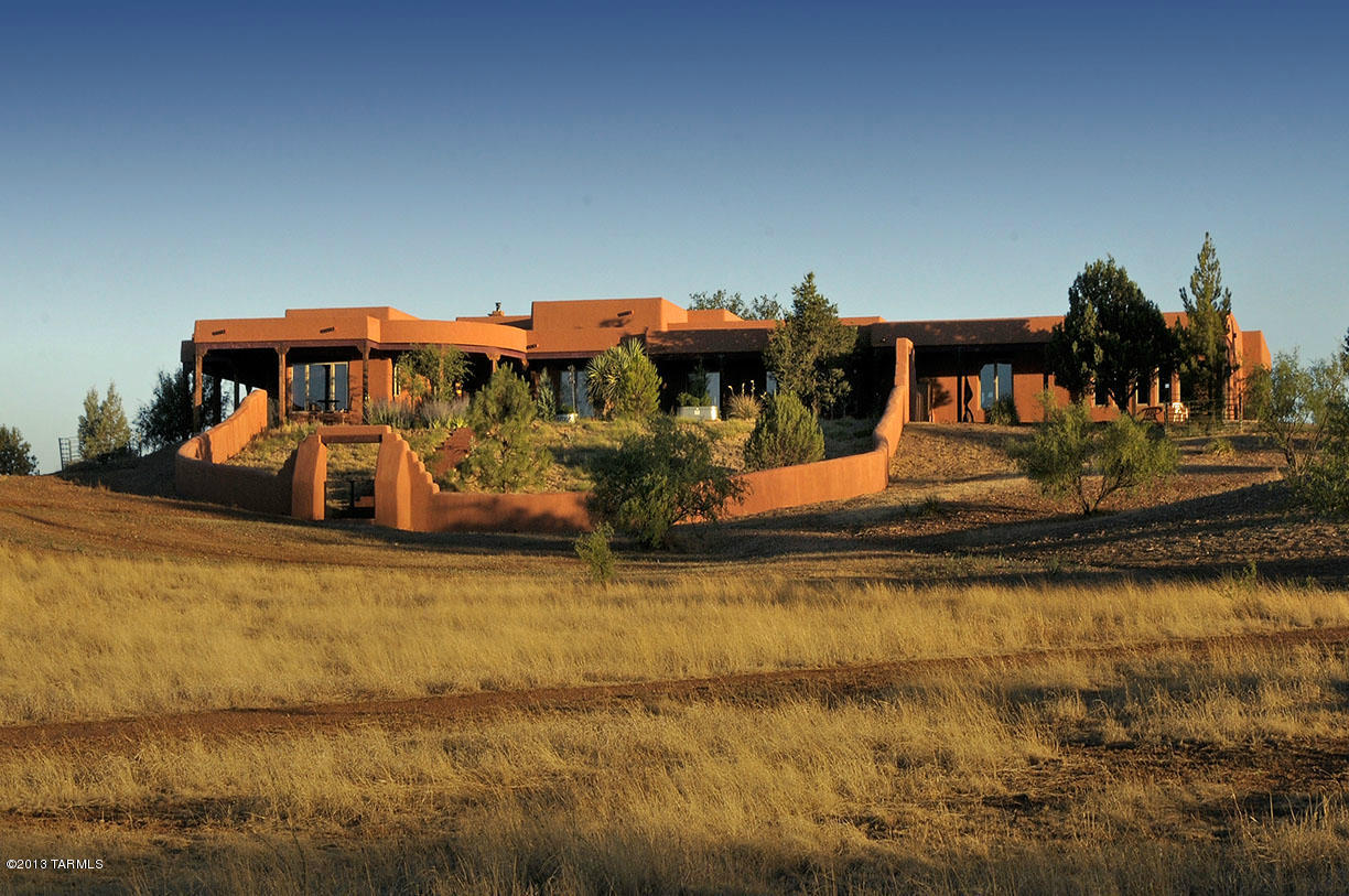 Spacious 5506sf 5BR/4BA rambling Santa Fe resting on 26 gentle rolling acres in SE AZ's coveted wine and ranch country!  Breathless mtn. views all directions & rich in outdoor living space including cov'd porches frnt & back, courtyard entrance w/numerous mature trees.  Interior includes high ceilings, spacious Great Rm w/FP, Chef's kitchen, formal DR, lux Master BR/BA w/FP, office,, plenty of guest rms/baths, 3-car garage, and plenty of room for your horses. - all less than 1hr SE of Tucson. Enjoy country living at its best with near perfect climate and endless  riding, hiking, and birding pursuits.