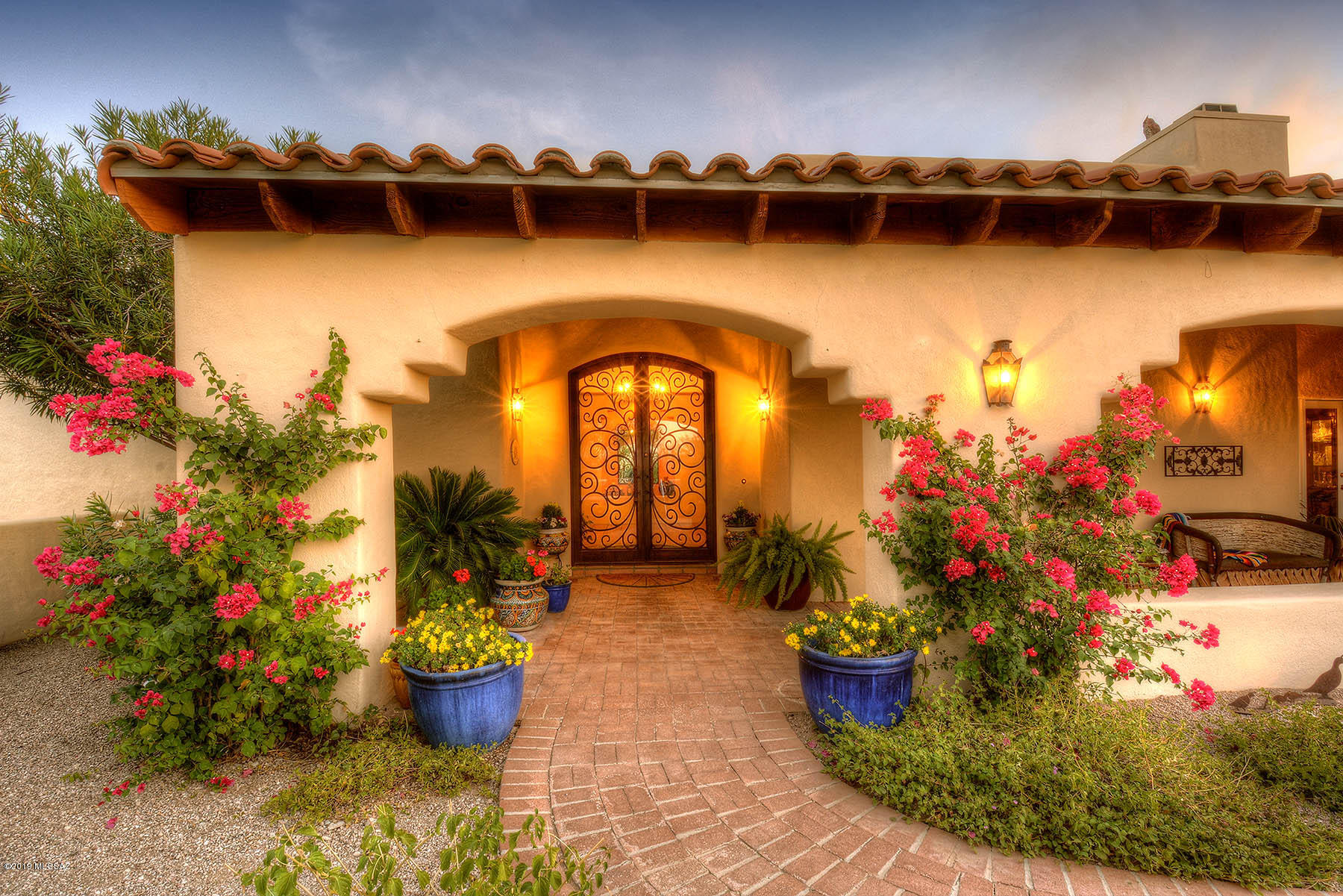 Spectacular Home Located in the Heart of Catalina Foothills with Mountain Views.  Well Maintained Spacious Interior Open Floor Plan features:  Gorgeous wrought iron front entry French doors, large living areas, large master suite w/ f.p. & views; master bathroom w/ separate shower/jetted tub & good size walk-in closet; kitchen w/upgraded cabinets, pullouts, corion countertops, island w/ gas cooktop, convection oven, & bar seating exposed wood beams in family & living room areas; fire places in living rm, family rm, & master suite; ceiling fans throughout. Professionally designed backyard is perfect for entertaining featuring: outdoor kitchen w/ gas bbq grill; gas fire pit; long/deep covered patio, pool, spa, water feature, extensive flagstone, low voltage lighting, & more. 1.4 acre Lot.