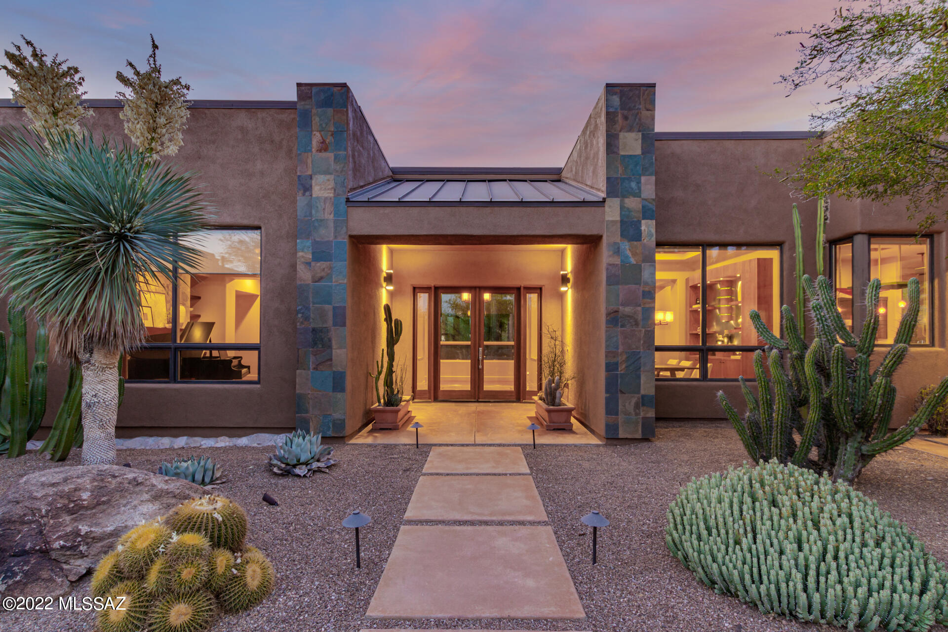 Stunning Pima Canyon Estates luxury residence. Custom built home designed around a unique lot with spectacular mountain and natural desert views from every window. Brilliant architectural & landscape designs embrace the desert gracefully. Indoor and outdoor spaces blend together through a glass breezeway/corridor that connects the main living area with the master suite and executive office. Large covered patio opens to the pool and spa. Chef's gourmet kitchen. The ideal home for entertaining and comfortable Sonoran desert living. Guest room/private patio located on separate private wing of house.  Located behind 2nd gate for added security and privacy. Brand new interior/exterior paint and carpets.  Agent/Owner.