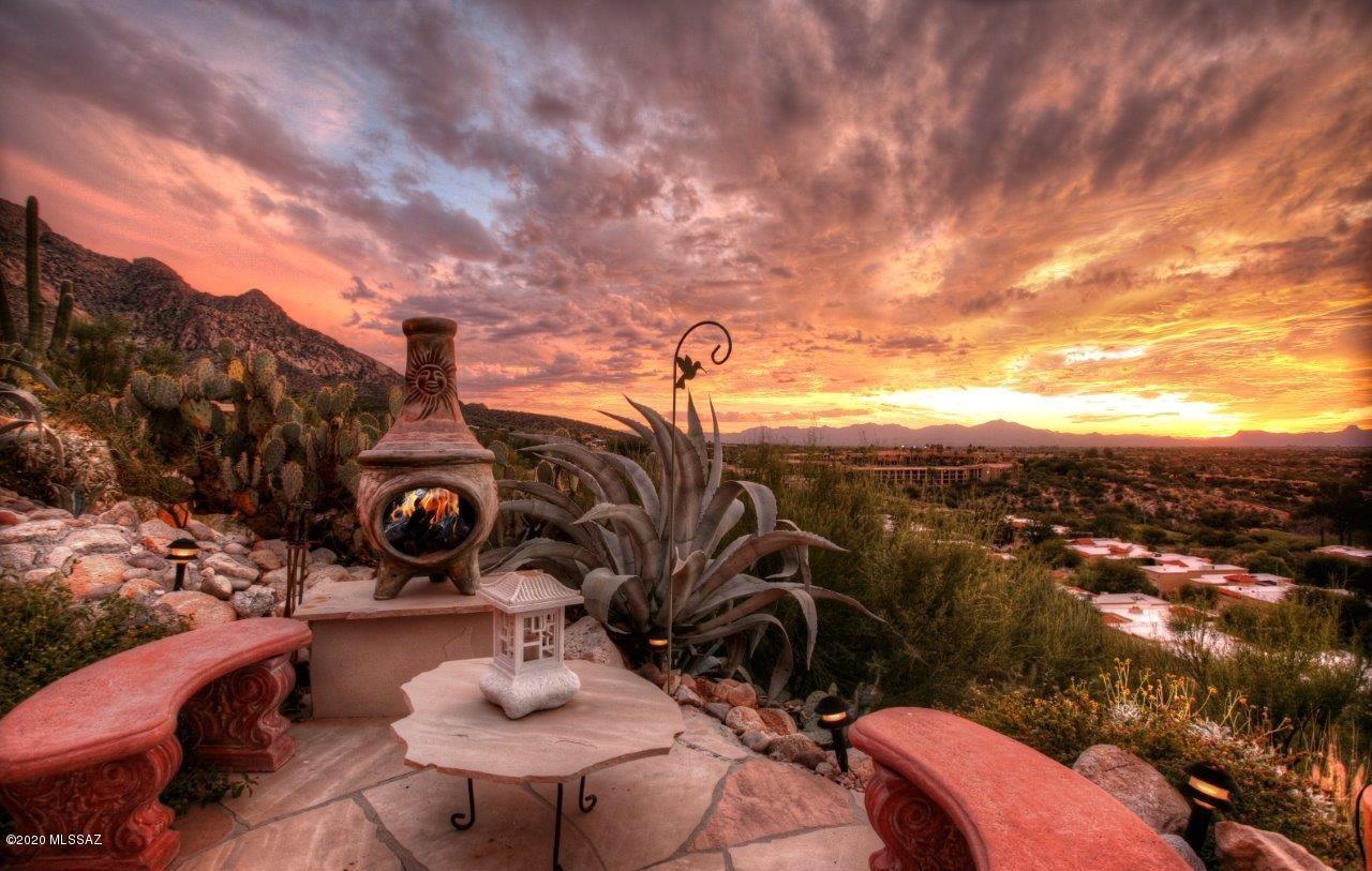 Gorgeous LA RESERVE Beauty! AMAZING VIEWS of Catalina Mountains, Twinkling Lights & Breathtaking Sunsets are Yours with this Beautifully Upgraded Home nestled in Gated La Reserve in the Heart of Oro Valley.  Enjoy your Private Gated Front Courtyard, Tranquil Fountain, Lemon Tree & Flowering Blooms. Enter Home through Custom Security & French Glass Doors. Large Great Room and Dining Area Opens to a Wall of Windows Providing PHENOMENAL Views & Lots of Natural Light. Beautiful Updated Kitchen, Granite Countertops, Large Breakfast Bar, Tons of Cabinets, PLUS a Pantry. Huge Master Suite w/ Vaulted Ceiling, Large Walk-In Closet & HUGE Bathroom. Large Covered Patio, Extended Flagstone, Hot Tub & VIEWS VIEWS VIEWS! Spectacular Sunsets & Stargazing are YOURS at Rare Find in Exclusive La Reserve!