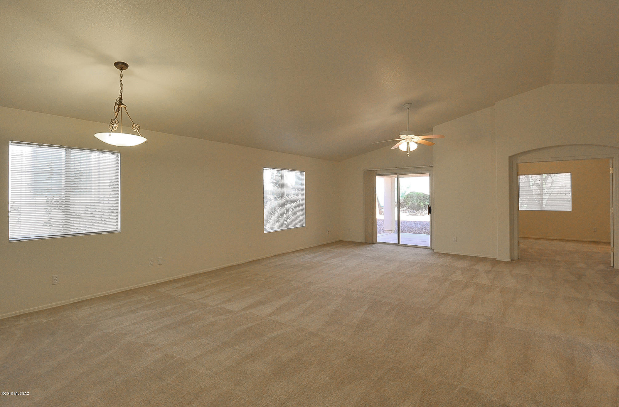 This is lovely home is located in beautiful Dove Mountain with easy I-10 access.  It features an open floorplan with high ceilings and soft, neutral colors and fans throughout.  The great room is large with a formal dining area.  The large master suite is entered through French doors and has spacious walk-in closet.  The en-suite has tub/shower and dual vanities.  Kitchen has a pretty breakfast nook at front of home and lots of counter space, storage, gas stove and new frig.  The fully walled back yard is pretty and private, and both back and front yards are easy care landscaping.   Of course, Dove Mountain amenities include a park with Ramada, Tennis, playground, basketball courts, BBQ grills.  You'll love the lifestyle!  Dog friendly w approval; sorry no cats.  P#3199-M
