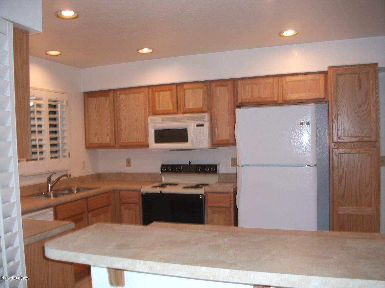 Walk into this large living area with wood floors, Kitchen has eat-in area plus breakfast bar. Bedroom are upstairs, master bedroom has walk-in closet, very large open bathroom, plus a sitting room area (with mirrored door closet), spare bedrooms are good size also perfect for large beds. Lots and Lots of natural light in this home, solar shades on windows and two patio doors that lead to outside backyard. Located on Cul-de-Sac street. Community pool just a few blocks away. Close to shopping and major amenities.