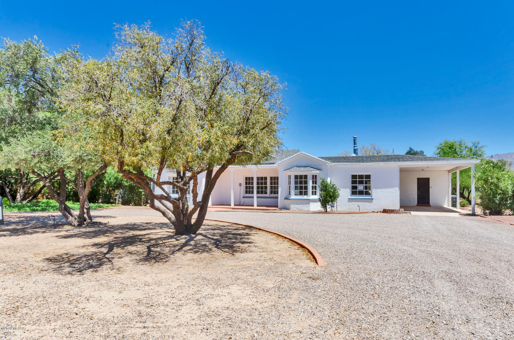Rare opportunity in desirable Richland Heights neighborhood. 4 bedroom, 3 bath home on a large potentially dividable .83 acre lot.  This  masonry/ frame stucco home has been updated, opened and refreshed while still keeping the traditional mid-century elegance of it's historical past. Catalina Mountain views frame the extended natural desert lot beyond the walled back yard. Located on Tucson's Campbell Rd corridor provides inhabitants easy access to U of A, Banner Hospital, La Encantada foothills shopping and many wonderful restaurants and shopping venues.  A treasure!