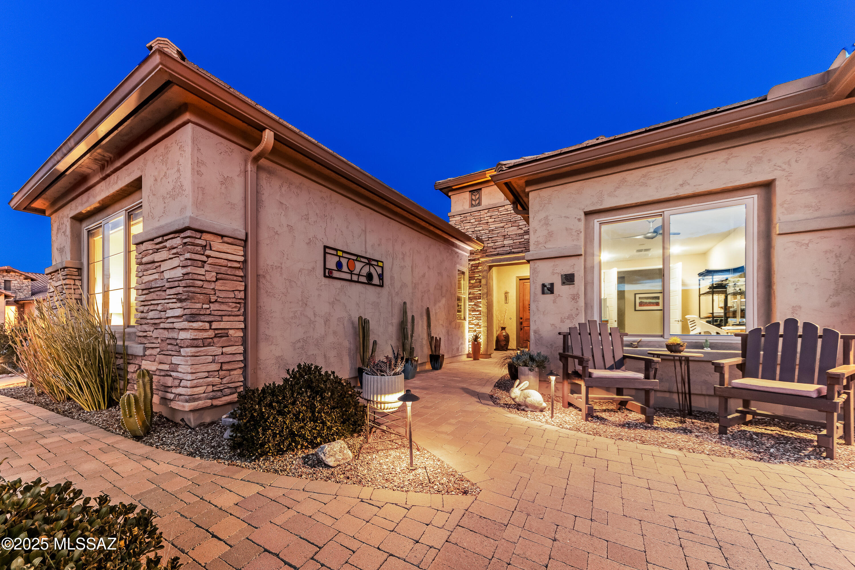 Experience resort-style living in SaddleBrooke Ranch in this expanded 2,962sf Vienta model, perfectly situated on a premium corner lot w/stunning Catalina Mountain & Mt. Lemmon views. This 3BR/3.5BA home, plus den & versatile hobby room/artist studio, is packed w/upgrades & designed for comfort & elegance. Gourmet kitchen features birch soft-close cabinetry, quartz countertops, matte gray appliances & 5-burner gas cooktop. Spacious angled island has Blanco sink & bar seating creating the perfect gathering space. Beautiful 18'' tile flooring extends throughout the home. Each bedroom offers a private en-suite bath & walk-in shower. Garage includes utility sink, water softening system, service door & epoxy flooring. Professionally landscaped fully fenced yard w/view fencing & side yard