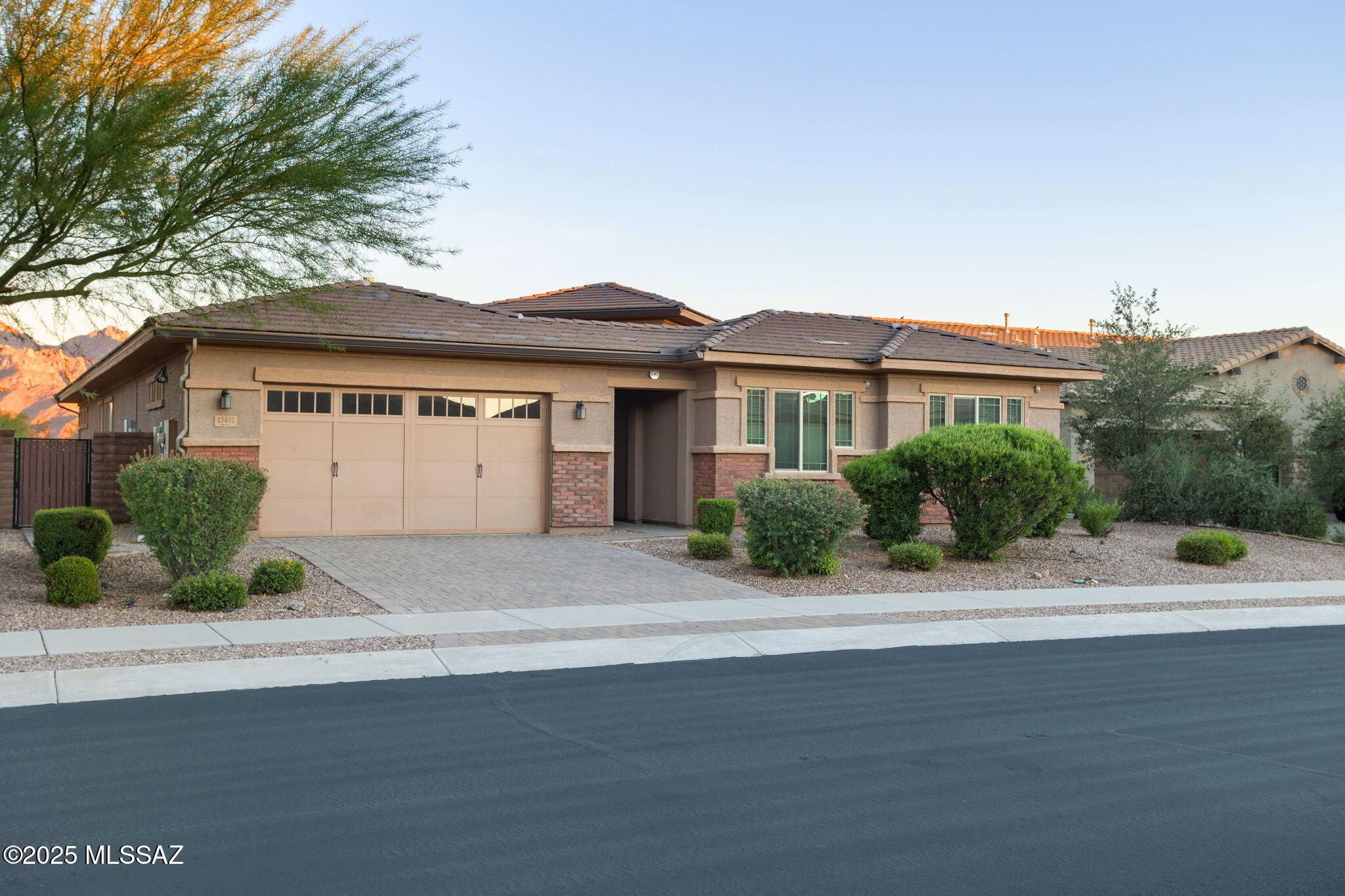 Some of the most breathtaking views in Tucson! This Maracay home is exceptional in quality and finishes. Located in the heart of Oro Valley, yet tucked away in the quiet and exclusive community of Center Pointe. This 4 bed/3 bath (plus office/den) home sits on a .26 acre premium lot. Upon arriving, home boasts a grand paver driveway & private patio entry. Open floor plan with a grand living room that features a beautiful stone fire place and stunning views. Gourmet kitchen has SS appliances, granite countertops, extended cabinetry, island w/breakfast bar seating, walk-in pantry, double ovens, built in microwave, & large eat-in breakfast area off the kitchen with also mountain views. Views, views, and more views. Reverse osmosis water filtration system, water softener, and PAID SOLAR!! Separate master retreat also has gorgeous views of the mountains through its bay windows. Master bedroom invites w/ spa-like bath well appointed w/ custom walk-in tile shower, soaking tub, humidity sensor, two separate sink vanities w/ granite counter tops, & huge walk-in closet. A second bedroom is located close to the master suite for convenience. Split floor plan with separate wing where you find two more bedrooms, a bathroom, and an extra family/media room perfect for privacy and guests. Home also has an office/den with French doors. Access the resort-like backyard through a 12' glass slider door and enjoy the indoor/outdoor living. Covered patio and back yard has beautiful paving stones and custom lighting, pre-wired surround system, gas fire pit w/ seating area, built-in barbecue and bar, automatic decorative outdoor floor lights, and engineered grass. Enjoy the Kafir lime, fuji apple, pomegranate, plum, and multiple citrus trees, all overlooking stunning unobstructed views of the Catalina Mountains! 3 Car extended garage. Fresh Interior paint. Center Pointe amenities include Olympic size pool, spa, interactive splash pad, covered ramada, bbq/picnic areas, fire pit, grass field, park with playground, and hiking/walking/biking trails (just steps away from your back yard). Close to shopping, restaurants, Northwest Hospital, Leman Academy, and renowned Basis School. Oro Valley  rated in 2025 by Travel and Leisure as the best city to retire in the U.S. This exceptional property offers the perfect blend of luxury & lifestyle. Experience the finest in Arizona living. Schedule your private tour today!