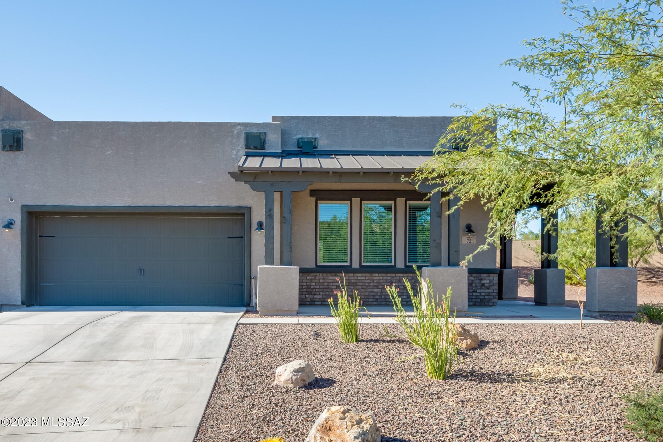 Discover this popular 1,760sf 2BR/2BA Drift plan w/Desert Contemporary elevation in Gated Ridgeview at Vistoso Trails. This end-unit offers a warm and inviting front wrap-around patio and thoughtfully designed split bedroom layout. Interior features spacious great room w/impressive 8' slider to covered patio & open dining room. Kitchen is a true chef's delight, adorned w/staggered cabinets, energy-efficient LED under-cabinet lighting, exquisite granite countertops, tasteful tiled backsplash, stainless appliances, large island w/breakfast bar & convenient walk-in pantry. Master suite offers huge walk-in closet, linen station in bathroom, dual sinks & walk-in shower. Charming L-shaped back patio w/brick pavers w/Catalina Mountain View is great for relaxing and entertaining! Other upgrades include tiled bath surrounds, two-tone paint, gas BBQ stub-out, 8' interior doors, ceramic tile plank flooring, security screen door & more. Private amenity park including pool, spa, fire pit & BBQ area. Located in the highly sought-after Rancho Vistoso community, you'll enjoy proximity to shopping, dining, medical, theaters, bike trail, Oro Valley Market Place/Village Center, Vistoso Trails Nature Preserve & Catalina State Park.