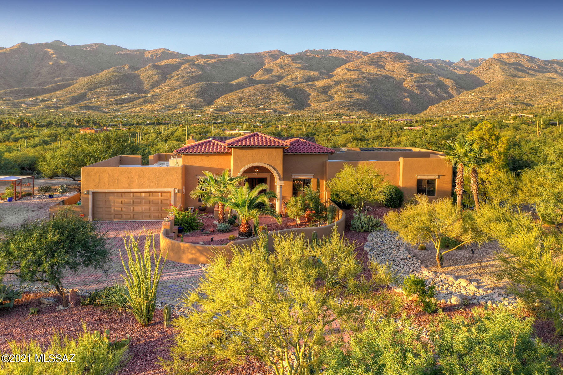 Southwestern beauty in Northeast Tucson.  Spectacular Catalina Mountain views & private setting on 3.35 acres. Energy efficient 3 BR plus Den.  High ceilings, many windows and an open floor plan. Kitchen features granite counters, gas stove & stainless appliances. Many updates including Pebble Tec pool, kitchen, master & guest bathrooms, driveway pavers and owned solar system & more.  Spend your days & nights on the full-length covered patio with outdoor fireplace, built-in barbecue, pool, spa and unmatched views.  Extended length 2-car garage & additional detached barn shed garage space. A second barn shed perfect for storage.  Raised vegetable garden.  Near Aqua Caliente Regional Park. Highly rated Tanque Verde Schools.  No HOA.