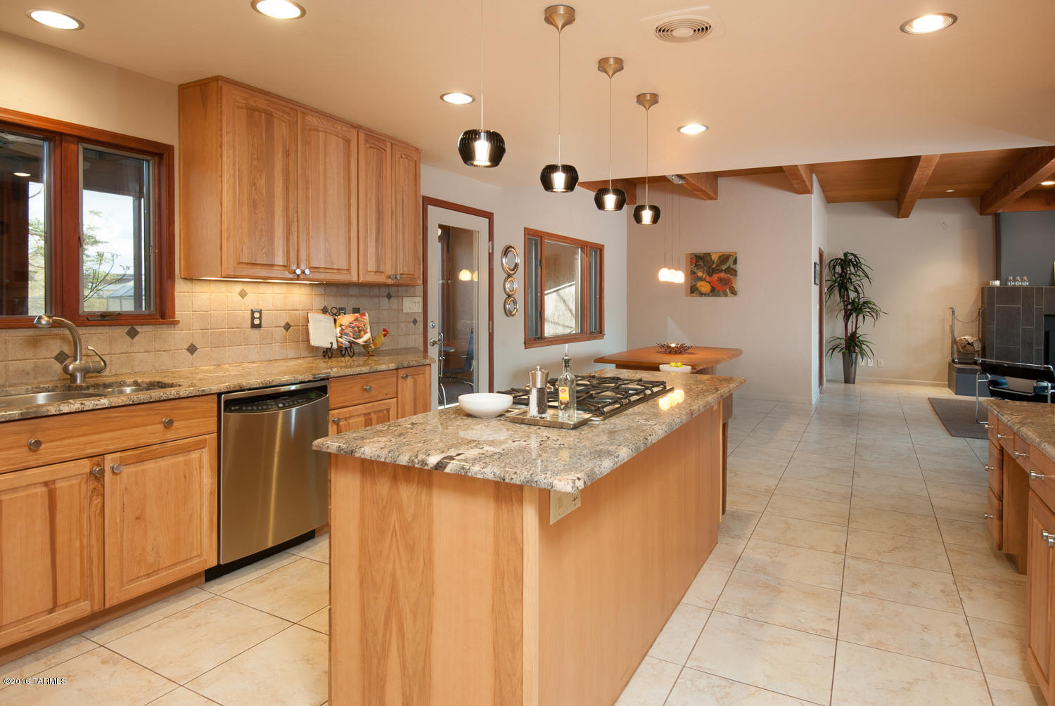 It’s immediately apparent that an individual with impeccable taste oversaw the renovations to this home. No expense was spared, and there isn’t a single cheap or underwhelming upgrade in the entire house. 3440 N. Lynford is filled with top-of-the-line, name brand selections, including custom cabinetry, slab granite and quartz surfaces, and luxury touches that truly go the extra mile. The home sits on significant acreage at the end of a long cul de sac. The grounds (3.39 acres) are more than enough room to accommodate the two covered RV spaces and detached two-car garage/workshop, in addition to the attached three-car garage. You’ll have incredible views of the Catalinas from both the north and west sides of the home, including the front patio, living room, media room, and master bedr Wake up and drink a cup of coffee on the private master patio, which faces north toward the mountains, and end the day with a glass of wine and mountain sunsets on the front porch. With two living spaces, a living room plus media room/den, the entire family can stretch out. The kitchen renovation makes cooking and entertaining a pleasure, with slab granite counters, matching GE Profile stainless appliances, custom cabinetry with soft-close drawers and slide-outs, stylish upgraded light fixtures, and under-cabinet lights. Move right from the kitchen to the screened back patio, a great location for hosting outdoor dinner parties. Both bathrooms are absolutely luxurious, with slab quartz counters and bathtub surrounds, Toto Washlet toilets, and chrome-finish fixtures. These are top-of-the line, luxury model home features. This is the renovation you would do if money was no object. See a full list of upgrades in Documents and the Photos tab.