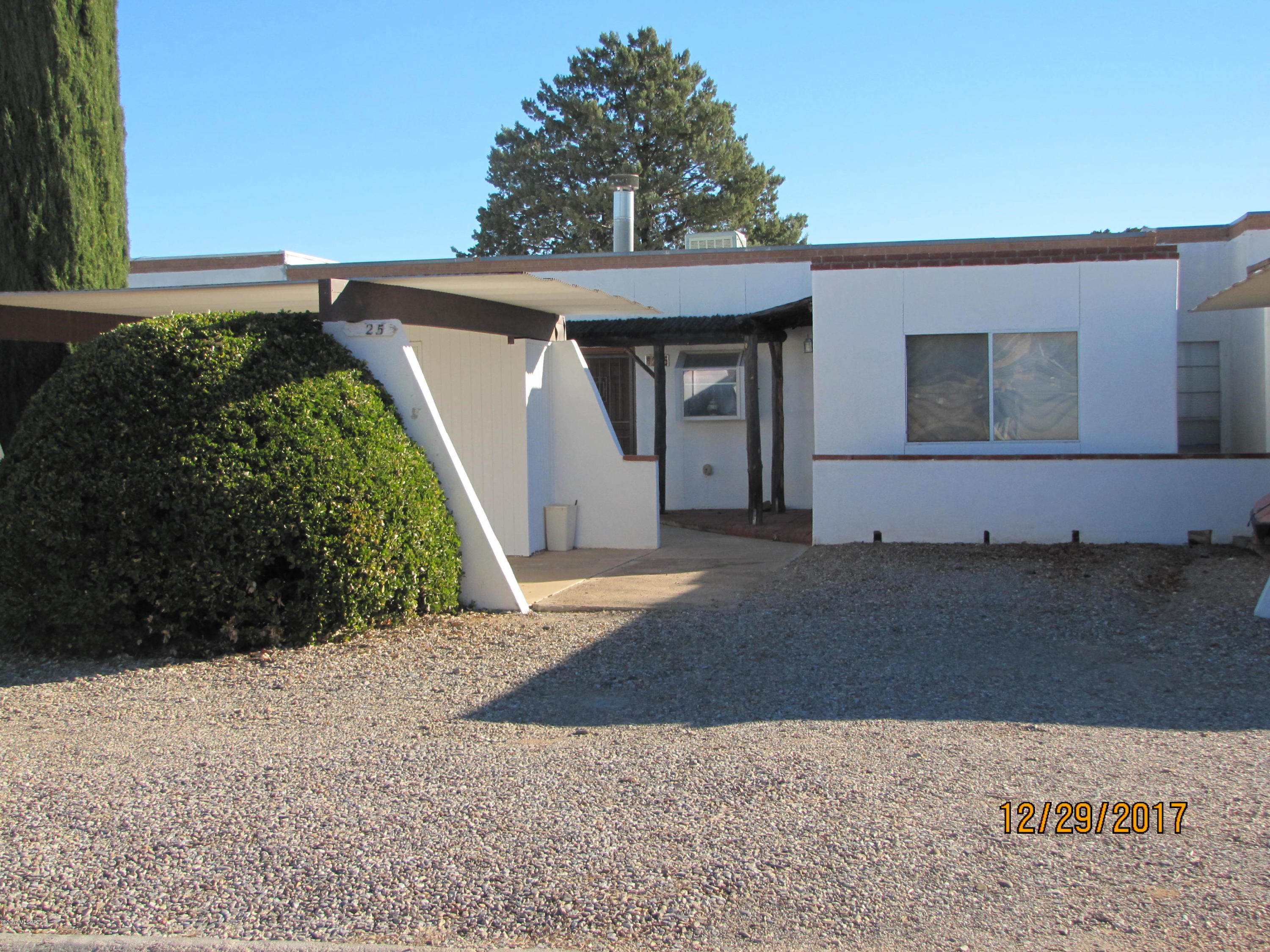 Partially furnished, upgraded 2BR/2Ba towhnhouse in Sunsites, with NO home owner's association. Split BR plan with bedrooms on either side of LR that has beehive FP and sliding glass door to covered patio inside walled back courtyard, with huge tree just outside wall for added privacy. Both MBR suite and guest BR have walk-in closets and separate baths, and each BR opens onto covered back patio. Room for eat-in in LR plus dining room. Additional room could be used as studio, game room, or other possibility. It has sliding door to front courtyard. Kitchen has can lights, lighted plant/knick knack shelves, and window over sink looking toward the west. Carport with attached storage shed by front courtyard. Not too far from Hwy 191 and access to I-10.