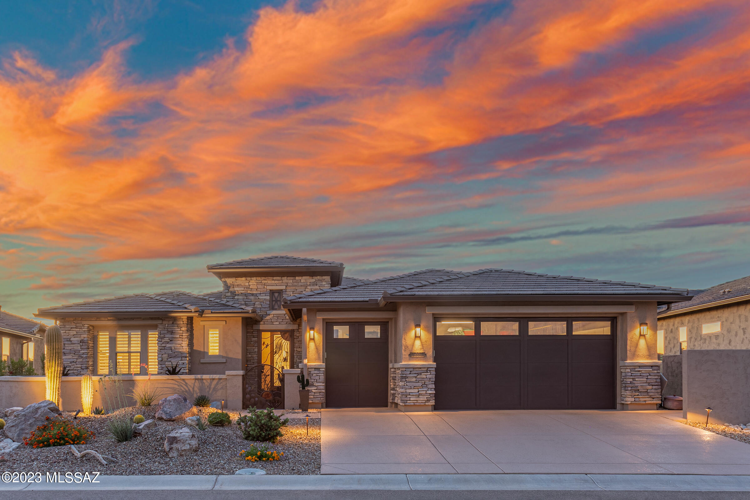 You will instantly fall in love with this stunning and highly upgraded
Tesoro - Premiere Series D Pool Home that has one the very best views any home can have here in SaddleBrooke Ranch! The 2459 square foot home includes 2-Bedroom En-Suites; Powder Room, Great Room w/custom built Media Alcove that includes an electric fireplace and audio/visual center; Dining Room; Grand Kitchen Island with adjoining Butler's Pantry and Walk-In Pantry; Dining Room; Spacious Extended  Office/Den with sliding barn door that can double as an extra bedroom; Owner's Entry Valet with Cabinets; Walk-In Coat Closet; Walk Up Dry Bar; Large Laundry Room; Deep (EXTENDED) 2-Car and Golf Cart Garage w/Extra Storage; Covered Outdoor Living Space (w/Options A & B), and 9' and 11' foot ceilings through-out the home. The EXTENDED Master Bedroom En-Suite has 2-Walk-In Closets (one has been EXTENDED); Dual Vanities; Walk-In Shower with Seat. Bedroom #2 En-Suite has a Walk-In Closet; and Shower/Tub Combo. Upgrades to the EXTENDED garage are full cabinets, soft water system, and epoxy floor.  The backyard includes a new salt-water pool with an incredible water feature and Pentair Pool equipment the best you can buy!); a Built-in Napoleon BBQ Kitchen; Tucson Rolling Shades; and a custom rock firepit where you will most certainly spend your evenings. The view from the Great Room and Dining Room into the backyard and pool is truly what defines this home. Whether you relax out in the exquisitely designed entertainer's backyard or under the extended covered living space, you have absolutely the most incredible views of summer sunsets. If you are one who believes the location of a home is the most important thing when considering buying a home, look no further as this is the home where the new story in your life begins!