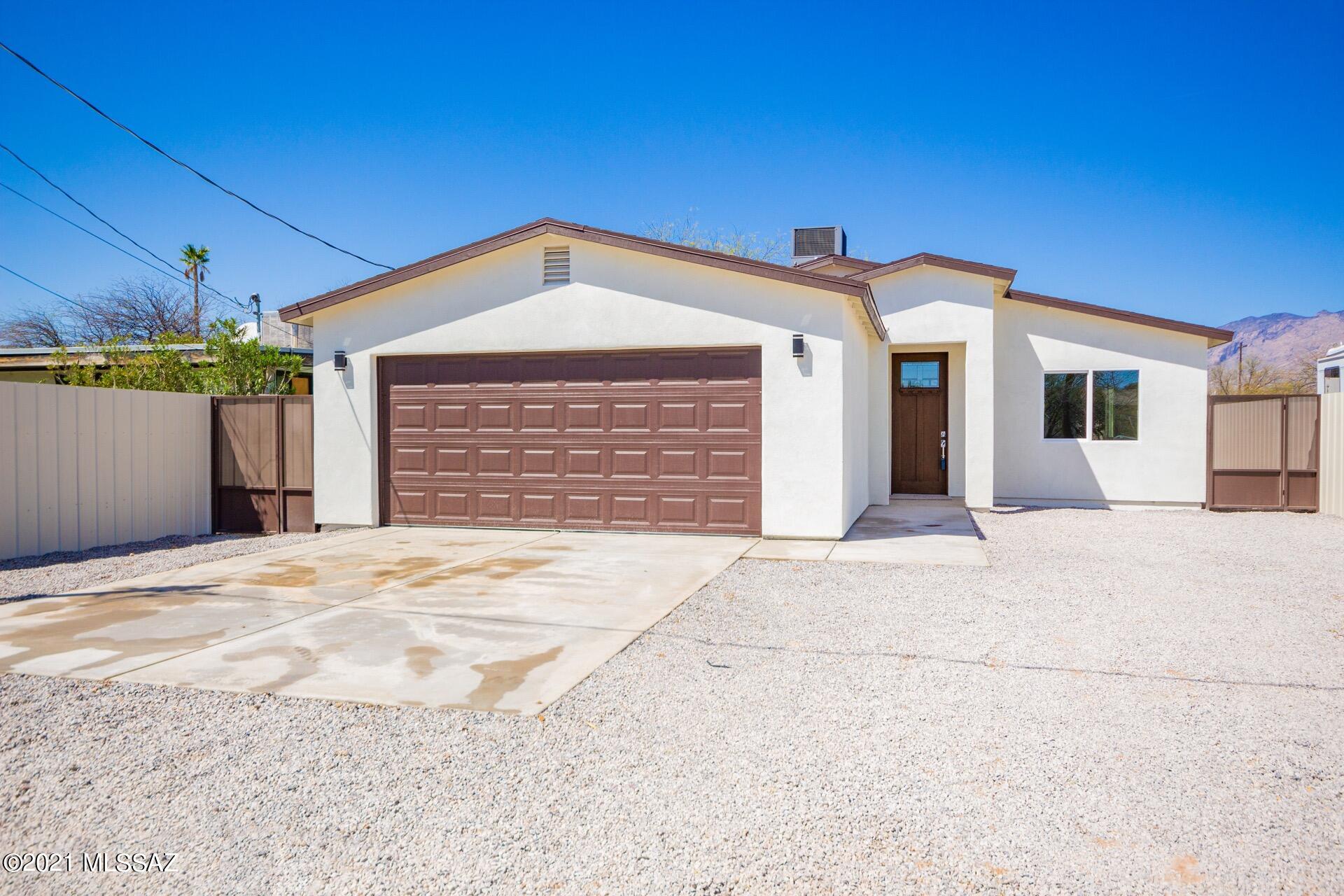 Gorgeous new built home w/handsome wood ''look'' tile floors, trending palette, ceiling fans, upgraded lighting, & spacious great room floor plan. Stunning new chef's kitchen features a large center island, granite counters, SS appliances, tile wall, & beautiful white cabinets w/hardware. Patio access from the dining area. New plush carpet/padding in all bedrooms, ample closets, & impressive new baths. Private en suite w/designer fixtures, tile, dual sinks, & free standing tub. Interior laundry room.  The backyard w/a covered patio is a blank canvas for your future desert oasis. NO HOA! Take a tour today & fall in love!