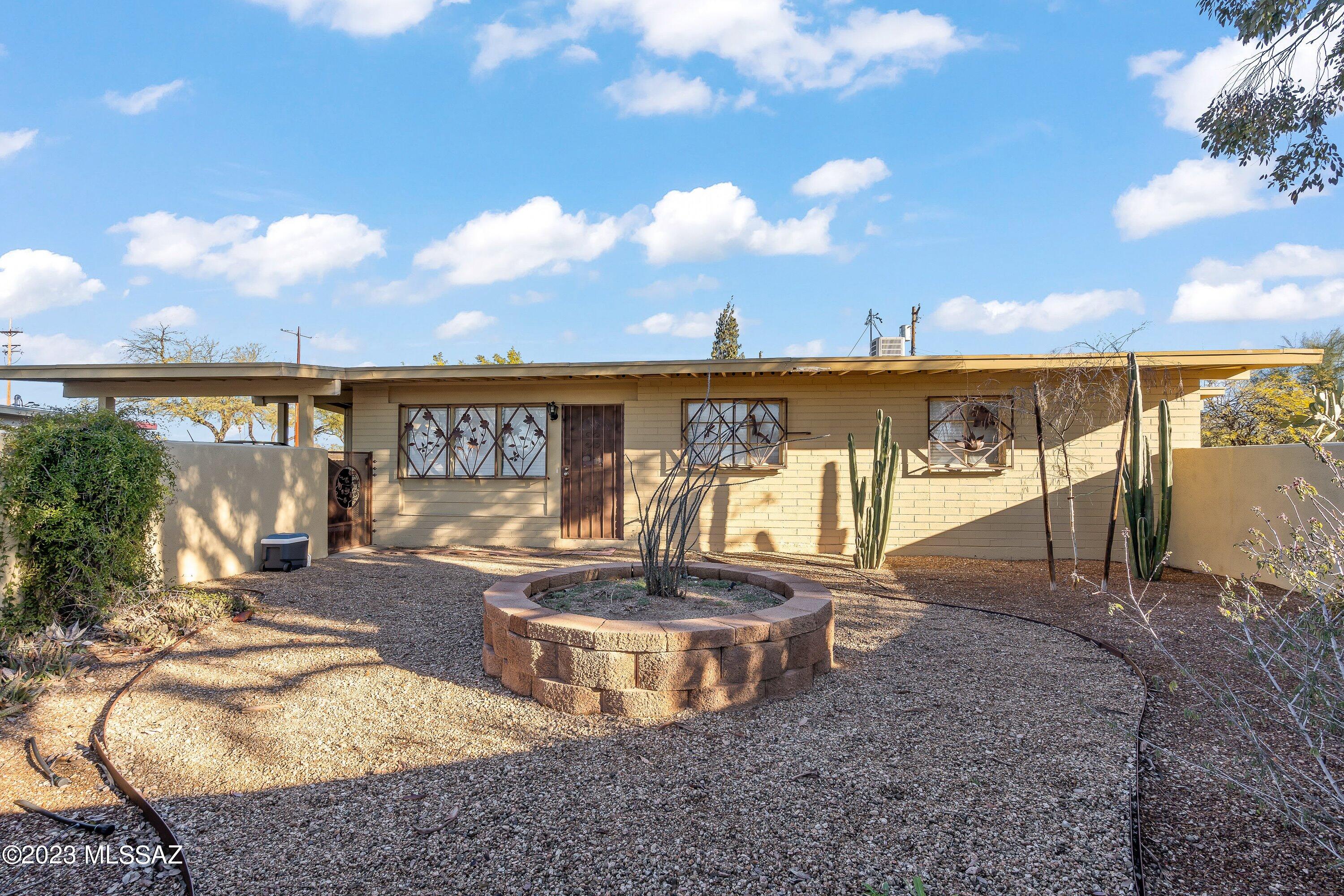 Beautifully renovated Mid-Century ranch style home on the central east side of Tucson. This home is ready for entertaining in the large back yard, hanging out in the quaint living room or enjoying family dinners at the table. This three bedroom one bath home has newer central air, wood planks and ceramic tile throughout, and Tucson charm in the kitchen. Call us to schedule a private tour or to get more details about the home. We are excited to serve.