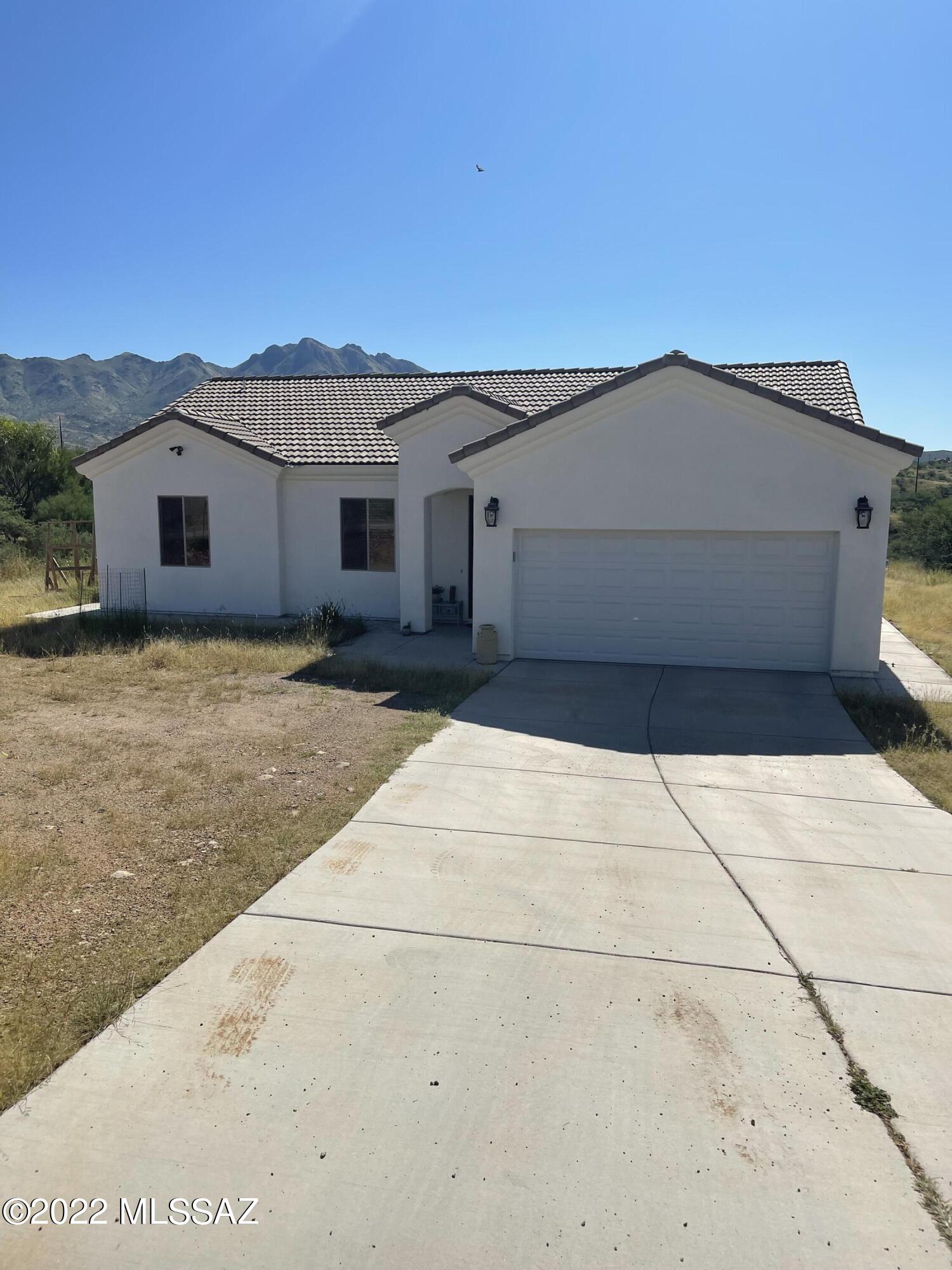 Shows like new!   Great opportunity to buy this 3 bedroom/2 bath home without the wait. The open floor plan of the living room, kitchen & dining area provides the open feeling of this home. It also has a large master bedroom with a walk in closet. Vaulted ceilings, upgraded light/plumbing fixtures, tile roof, tankless water heater, stainless steel appliances, granite countertops, lazy susan, oversized pantry, wifi thermostat, 8ft bedroom doors  and ceramic tile floors are some of the many extras. The rear patio has unobstructed views of the surrounding mountains.   Easy access to the freeway.