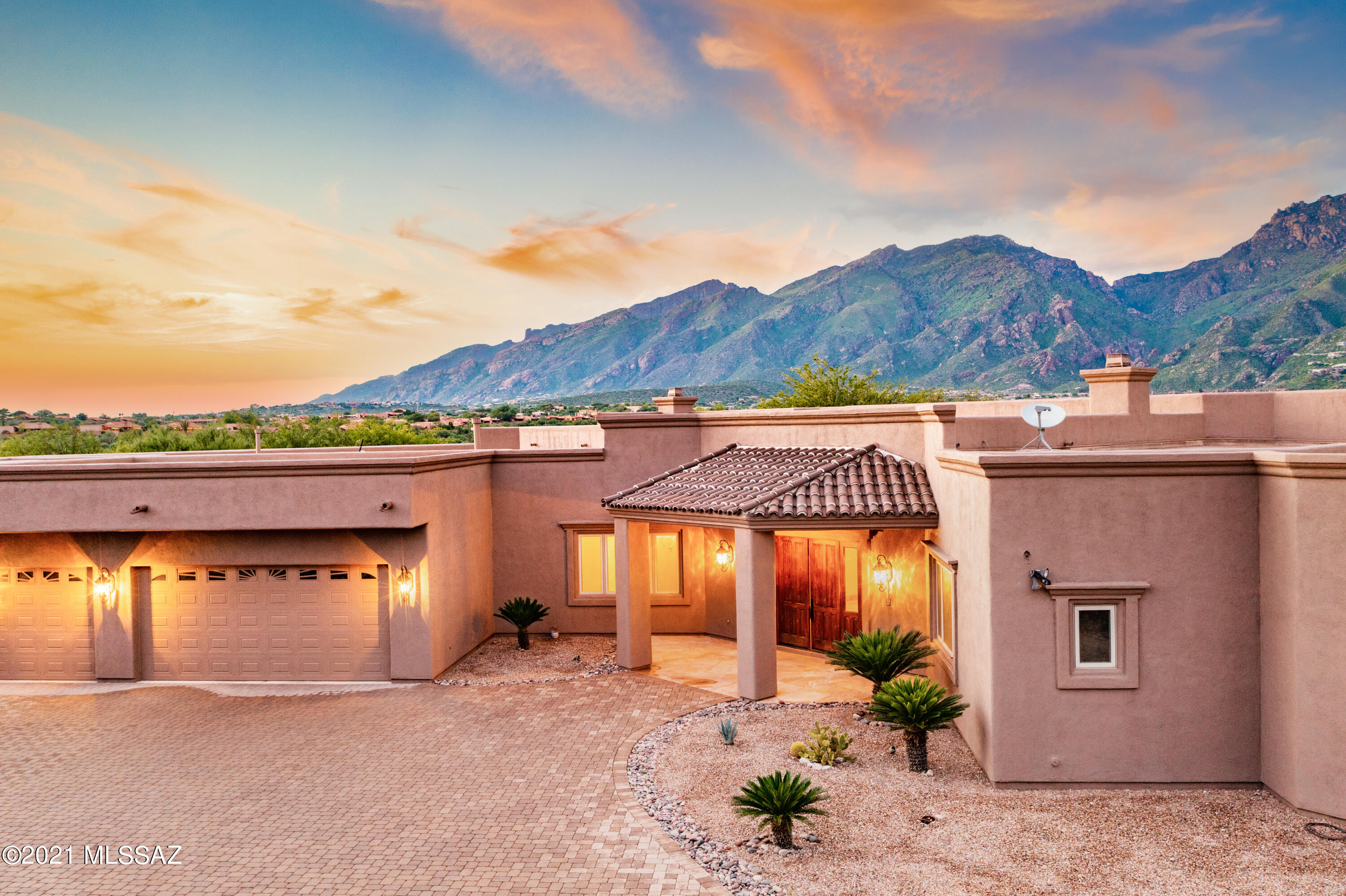 Unobstructed, Up-close 180 Degree Catalina Mountain Views & Uncommon Privacy Define this 2006 Custom Built Home on an Elevated .85 acre Lot Near Ventana Canyon.  Nearly 6000 sf, 5 bed/6 bath (all en-suite bedrooms) Sprawling Estate is all on One Level- No Steps! Long Driveway Lined in Pavers Leads up to Private Motor-court. Dramatic Entry w/ Wall of Windows to Capture Mountain Views Opens to  Living Room w/ Fireplace & Formal Dining Area. 24 x 24 inch Travertine Throughout. Beautifully Upgraded Gourmet Kitchen w/ Center Island, Breakfast Bar & Large Picture Window Framing the Stunning Mountain Views. Oversized Pantry & Powder Room for Guests.  Kitchen Opens to Family Room w/ Doors to Patio & Resort Style Backyard w/ Pool, Spa & Built-in BBQ. Exceptional Master Suite  CONT.. with Fireplace has Spa-Like Master Bath with Double Vanities, Extra Large Separate Shower, Separate Bathtub w/ Mountain Views & Huge Master Closet w/ Custom Built-ins. Each Bedroom has its own Full Bathroom with this Expertly Designed Split Bedroom Floor Plan. Full Exterior Paint Completed August 2021. Extra Large 3- Car Garage with Storage Room.