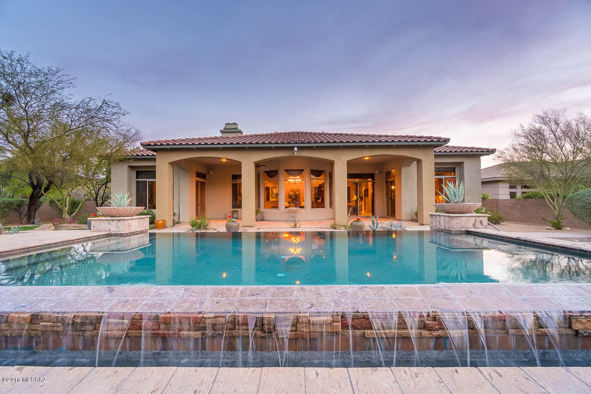 Seller shall respond to offers in the range of $997,000 to $1,110,000.Highly upgraded former Toll Brothers model in gated Solana at Dove Mountain backs to Gallery North Course 17th Hole boasting Tortolita views. Walk to Clubhouse or entertain outdoors by the Infinity pool and fireplace. This exquisite home features 3BR/4BA, attached 1BR/1BA GUEST CASITA w/private entry, Office and 2+1 garage bays. Tuscan inspired design opens to a Grand Foyer entry w/turret ceiling, chandelier & marble inlay tile. Elegant Great Room features Travertine floors, dual sitting areas, full Bar, faux stacked stone fireplace, circular Dining Room, and state-of-the-art Kitchen w/Breakfast Nook & Bar. Extended Master Suite w/sitting area hosts a faux stacked stone fireplace, wet bar, dual walk-in closets and more