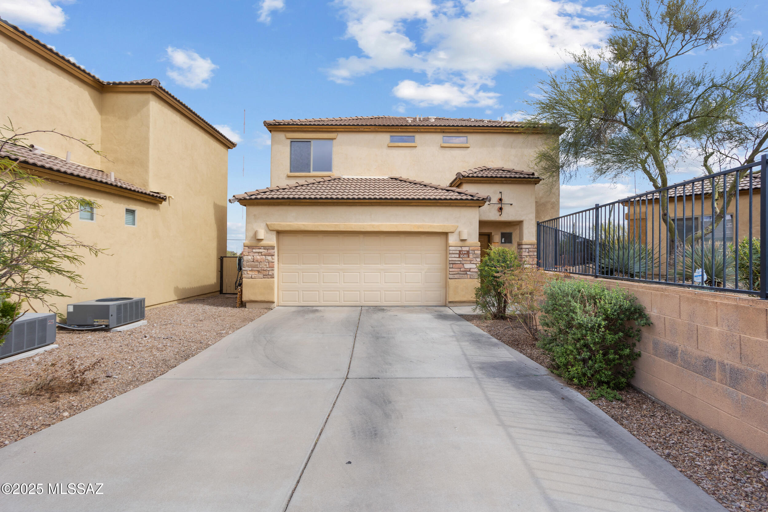 *The home is priced in a range from $320,000-$335,000. Seller will evaluate all competitive offers within this range* 
This beautiful home boasts newer HVAC and water heater, an extended driveway, and a spacious open floor plan. Located just 15 minutes from the University of Arizona and 5 minutes from Pima Community College West Campus, it offers both convenience and stunning mountain views. The home features tile throughout the first floor, a large lot, and no rear neighbors, providing privacy and a serene setting. Perfect for those seeking comfort, style, and a prime location.