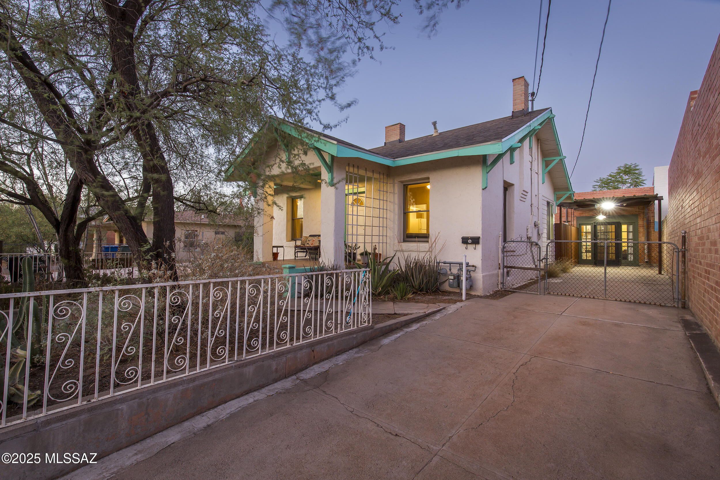 Located in the historic Iron Horse neighborhood, one of Tucson's most walkable and bikeable areas- this well-maintained c.1907 property offers a rare combination of vintage charm, modern upgrades, and future potential. The 1 bedroom, 1 bath main house features high ceilings, bamboo floors, and energy-efficient double-hung dual-pane windows that fill the space with natural light while enhancing year round comfort.

 A separate studio apartment adds flexibility for guests, rental income, or creative use, ideal for varied living arrangements or work-from-home lifestyles.

 Included in the sale is the adjacent vacant lot to the north, offering room to expand, garden, build, or enjoy as additional private outdoor space. This location boasts exceptional walkability ( 87 walk score) and bike access ( 99 bike score): 

 Just steps away 4th ave shopping & entertainment district and Downtown Tucson