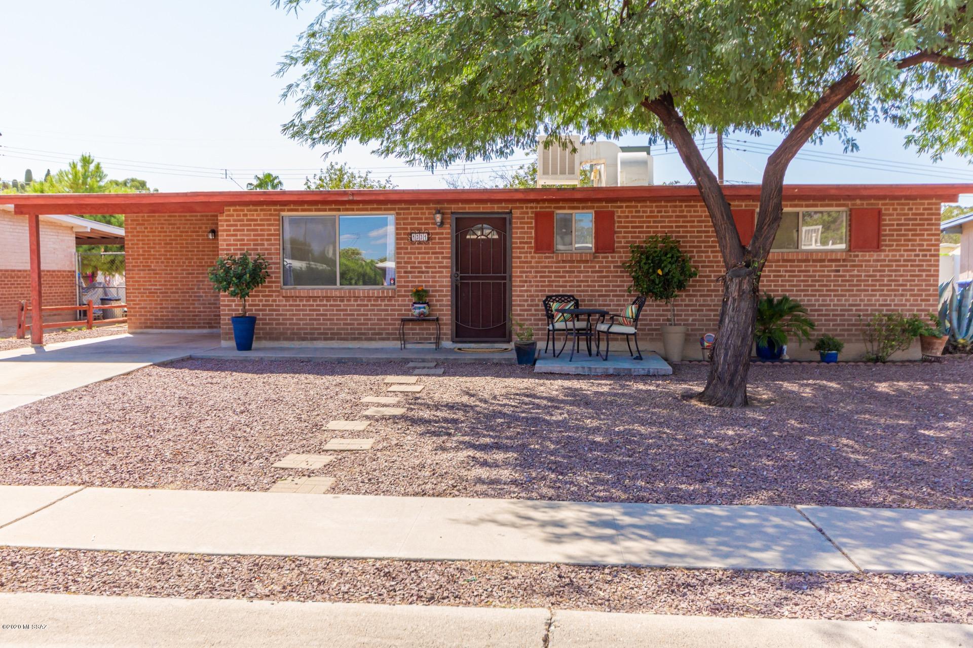 Take a tour and fall in love with this pristine, move-in-ready, red brick ranch style home! Neutral tiled floors, crisp palette, ceiling fans in bedrooms, freshly painted throughout with new electrical switches/outlets/plates, interior laundry room w/storage cabinets, office nook & patio access. Brand new 40 gallon water heater. Stylish kitchen counters, breakfast bar, & plenty of wood cabinets. Charming dining area w/ French doors to patio. Handsome engineered wood floors all in bedrooms w/ new baseboards, large closets, & 2 updated baths. The large backyard boasts a basketball court, play area w/ newly constructed fort, & room for a pool! Storage shed included. Close to Shopping, Restaurants, Transportation, I-10, & Schools.