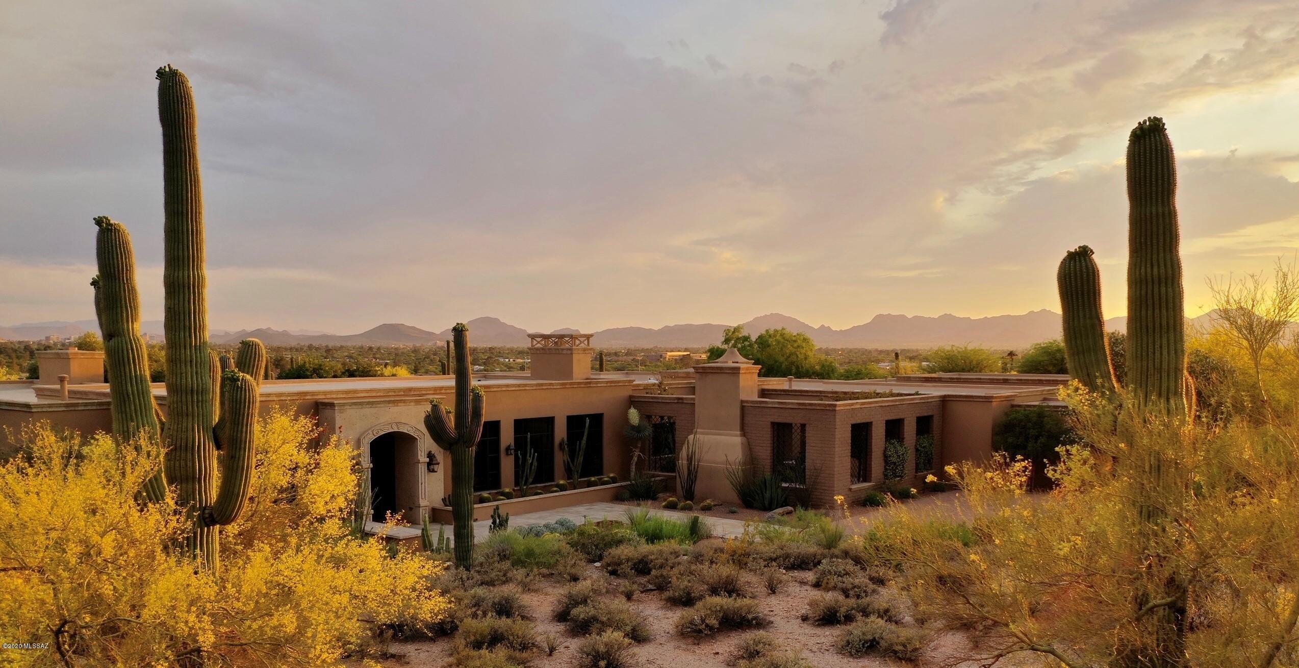 Casual Elegance at its Finest in this Foothills Masterpiece Built by Wachs Construction. This 4 Bedroom/7 Bathroom, One Level (no steps) Masonry & Steel Frame Home Features an Oversized Living Room w/Grand Fireplace Flanked By Magnificent Catalina Mountain Views on One Side & a Wall of French Doors that Open to an Expansive Covered Patio (Outdoor Living Room) Overlooking the Raised Cantera Trimmed Pool & Spa w/ Water Feature On The Other. The Formal Dining Room Includes French Doors, Dish/Wine Room & Butlers Pantry w/ 2 Dishwashers, 2 Refrigerator Drawers, Wine Refrigerator & Sink. The True ''Chefs Kitchen'' Features Richlite Counter Tops, Walnut Butcher Block Island, 48'' Wolf Range, 2 Fisher Paykel Dish Washers, 36'' Subzero Refrigerator w/Drawers, 27'' Freezer w/Drawers,Microwave Drawer Built in Miele Coffer Maker, Sub Zero Clear Ice Maker, 2 Sinks, Large Walk In Panty & Breakfast Room w/ Built Ins & Cantera Fireplace that Opens to a Large Private Courtyard w/Fireplace & Built in BBQ for Outdoor Dining & Entertaining. The Master Wing Features a Lavish Master Suite w/Fireplace, Exercise Room, His & Her Bathrooms, His & Her Walk In Closets and His & Her Private Offices w/Bathroom! (One Private Office Could be 3rd En-Suite Bedroom). Other Fine Features Include: 8' Alder Doors, Versailles Pattern Travertine Floors Inside & Out, Exquisite Beams & Crown Molding, Custom Lighting, Elegant Powder Room w/ Custom Bronze Sink, Laundry Room w/Custom Cabinetry & Sink, Speakers/Surround Sound, Central Vacuum, Alarm, 4 Zone HVAC & 3 Water Heaters. The Brick Paver Motor Court Leads to a 5 - 6 Car Garage w/ Workshop, Oversized Storage Closets & Bathroom. The detached 2 plus car garage has the ability to be converted to a partial guest quarters or a full guest house. This Home is One of Tucson's Finest! Co Listing Agent is related to the sellers.