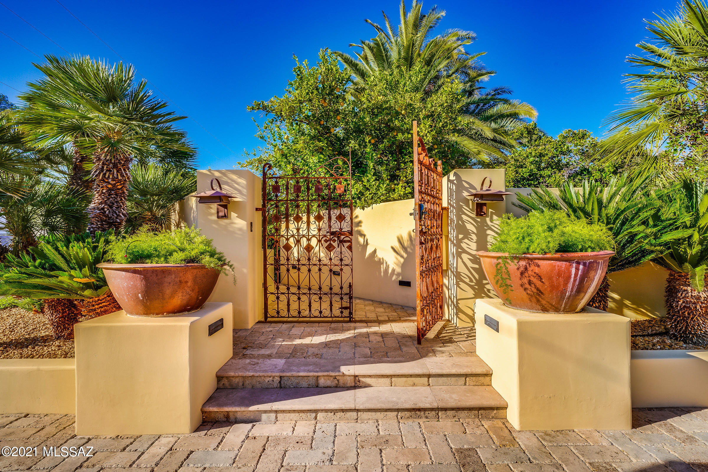 Gated Blenman Elm Sanctuary in the heart of Tucson near the Arizona Inn.  A Kevin Osborn designed property featuring a 2400 Sq Ft 2 Bedroom/ 2 bathroom main house with an additional 560 Sq Ft Guest House. Terraced vegetation leads into an Architectural Masterpiece. Brazilian Cherry wood Floors and Slate Countertops throughout. Master Suite features two Walk In Closets and an in Shower Steam Spa.  Professional Grade Kitchen w/ Thermadore Professional Appliances.
