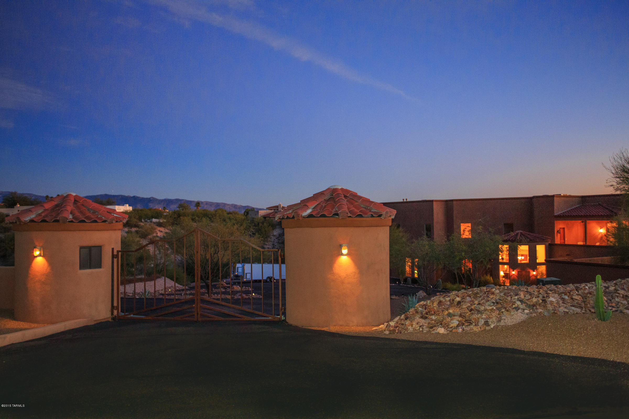 SELLER WILL ACCEPT OR COUNTER OFFERS BTW $999,000-$1,200,000- possible Owner Carry Back -MULTI-GENERATIONAL LIVING AT ITS FINEST!SITUATED ON A PRIVATE 2.6 ACRE LOT IN THE HEART OF THE FOOTHILLS, THIS 10,529 SF CUSTOM HOME IS PRIVATELY GATED & OFFERS INCREDIBLE MTN & CITY VIEWS FROM ALMOST EVERY WINDOW.  ENTER THRU A GRAND FOYER LEADING TO A SPACIOUS LIVING RM WITH FP & DINING RM WITH DOUBLE STORY CEILINGS & EXPANSIVE WINDOWS OFFERING EXCELLENT VIEWS. ALSO ON THE MAIN LEVEL IS A GUEST SUITE, OFFICE, GOURMET KITCHEN WITH LG ISLAND, GRANITE, BREAKFAST BAR, & WALKIN PANTRY.ADJACENT IS FAMILY RM WITH FP OR BREAKFAST RM.SWEEPING STAIRCASE TO THE UPSTAIRS WITH 3 HUGE MASTER SUITES, SPACIOUS MASTER CLOSETS, FP'S, OUTDOOR STAIRS LEAD TO A SEPARATE APARTMENT OR GUEST QUARTERS WITH KITCHEN AREA, FP AND BATHRM.  INDOOR OLYMPIC STYLE POOL, SOLAR HEATED. 2500 SF OF GARAGES - 3 CAR WITH WORKSHOP/STORAGE AND ADDITIONAL 2 CAR GARAGE WITH STORAGE.  BAMBOO AND TRAVERTINE FLOORING THRUOUT, BEAUTIFUL GROUNDS AND MOTORCOURT AREA, SPACIOUS COVERED PATIOS WITH BBQ AND FIREPIT TO ENJOY VIEWS. ROLLING SHUTTERS ON BEDROOM WINDOWS, WATER FEATURE IN ENTRY.  BEAUTIFULLY MAINTAINED INSIDE AND OUTSIDE. NOT IN AN HOA, OK TO PARK RV OR HAVE HORSES.