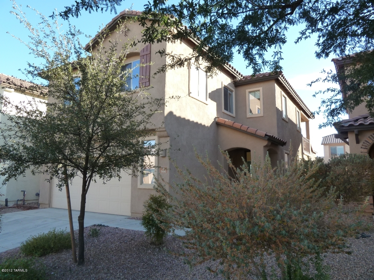 Make this house your HOME! This spectacular home is located in the desirable GATED subdivision of Lago Sereno, in beautiful Rancho Sahuarita! This home has it all! Fantastic upgrades including tile floors throughout the downstairs! Gorgeous cabinetry! Formal living room! Bonus family room with task lighting! Granite countertops! Top it all off with soaring ceilings that really make this home feel like a mansion! Upstairs features a loft, four bedrooms including spacious master suite with private patio! Owners bath has garden tub, double vanity, and large walk-in closet! Spacious yard is perfect for kids or approved pet! Conveniently located near wonderful neighborhood features like the lake, gym, and splash park! You NEED to see this one! CALL TODAY