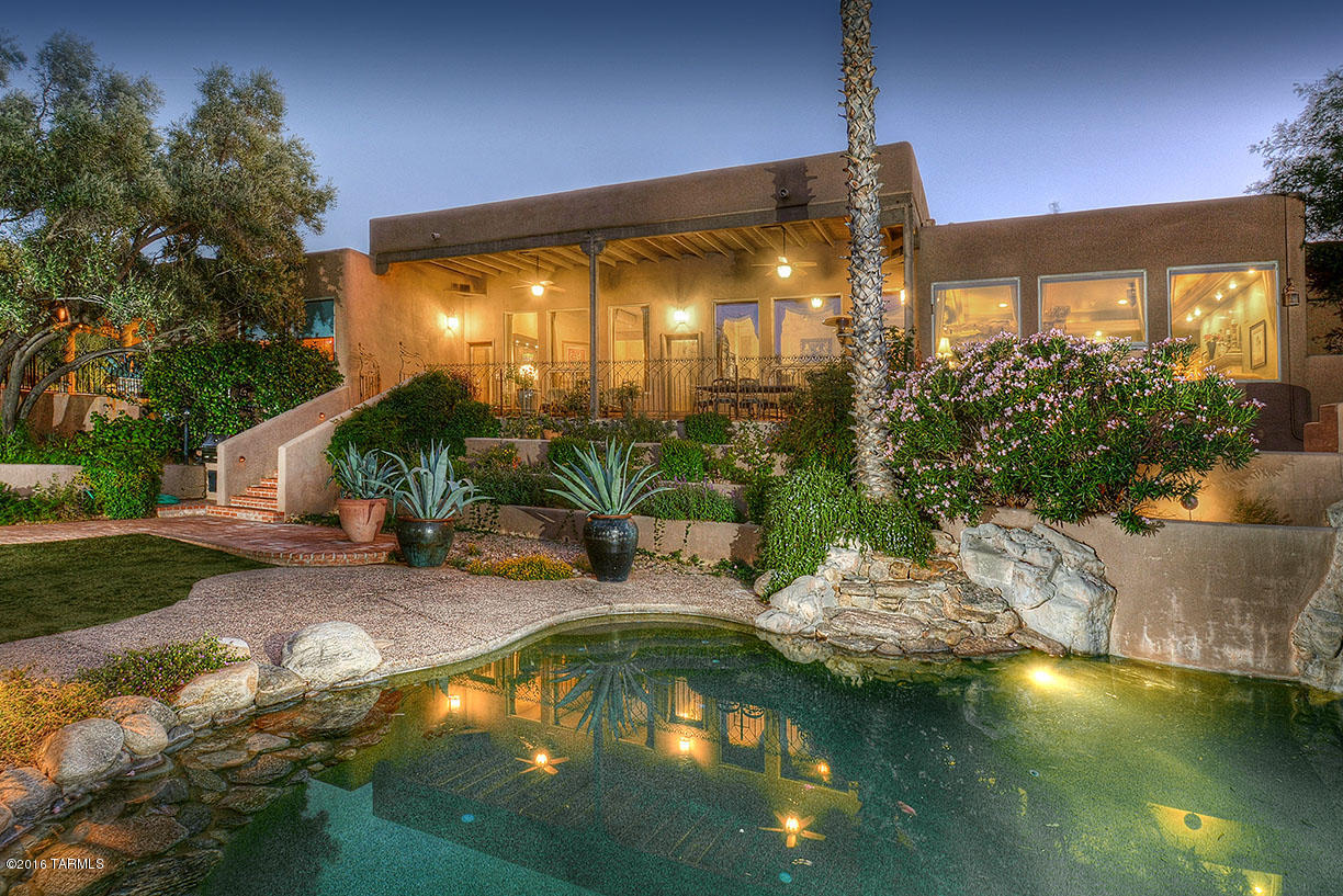 Fabulous house with incredible finishes throughout. Spectacular vistas of Catalina Mountains from long covered patio. Large backyard with pool, spa, grassy yard with trampoline and fire pit area. Indoors enjoy formal and casual living in the elegant living, family and dining rooms with high ceilings and two sided fireplace. True gourmet cook's kitchen w/Viking Appliances, Gaggenau steam oven, dishwasher drawers, and wine refrig. Ensuite bedrooms with outdoor game room, office with custom builtin cabinetry, exercise room and home theater. This home sits high on a private 1 acre lot with views of the Ventana Canyon golf course.