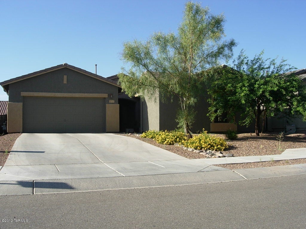 AVAILABLE NOW! You'll want to see this attractive & comfortable home located in the desirable southeast subdivision of Mesquite Ranch in Vail School District. Amenities of this 4 bed. 2 ba. home includes newer decorator flo0r tiles, kitchen, and newer carpet in the master bedroom; a spacious great room, open kitchen w/breakfast bar, split bedroom plan, nice size yard, covered patio, 2 car garage, & community pool to name a few. Please contact listing agent or your own agent to schedule a viewing of this property. Let us know if you have any questions about this property, our lease terms, application requirements, and/or pet policies. See our web site (www.PimaRealEstateServices.com)) ) for more info, to check the availability of this property , or to submit a rental application.