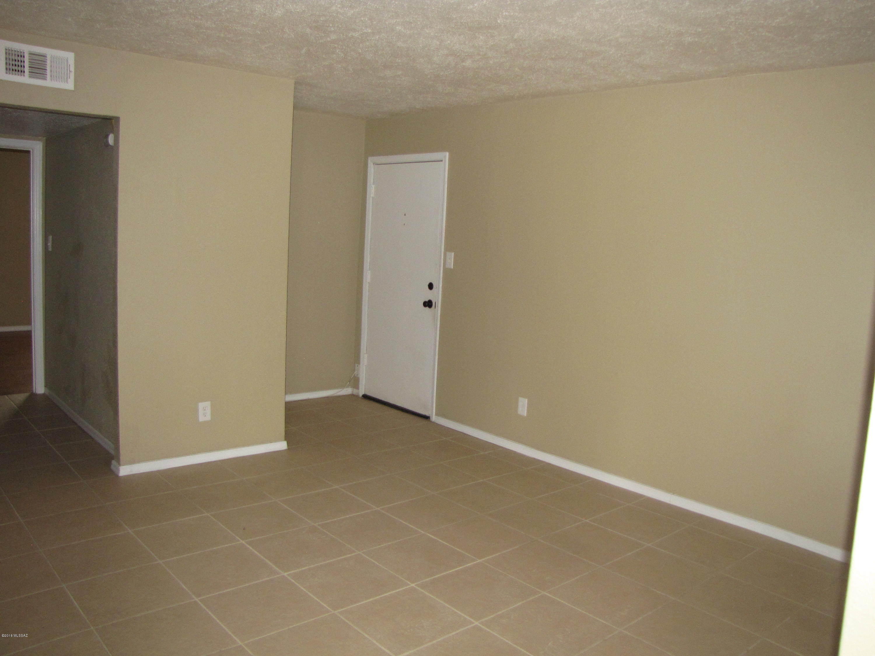 Upstairs 2 bedroom, 1 1/2 bath condo.  Very clean.  Tile and wood floors, carpet in  Master.  A/C, community pool.  1 covered carport. Near Wilmot and Speedway.  One year lease.