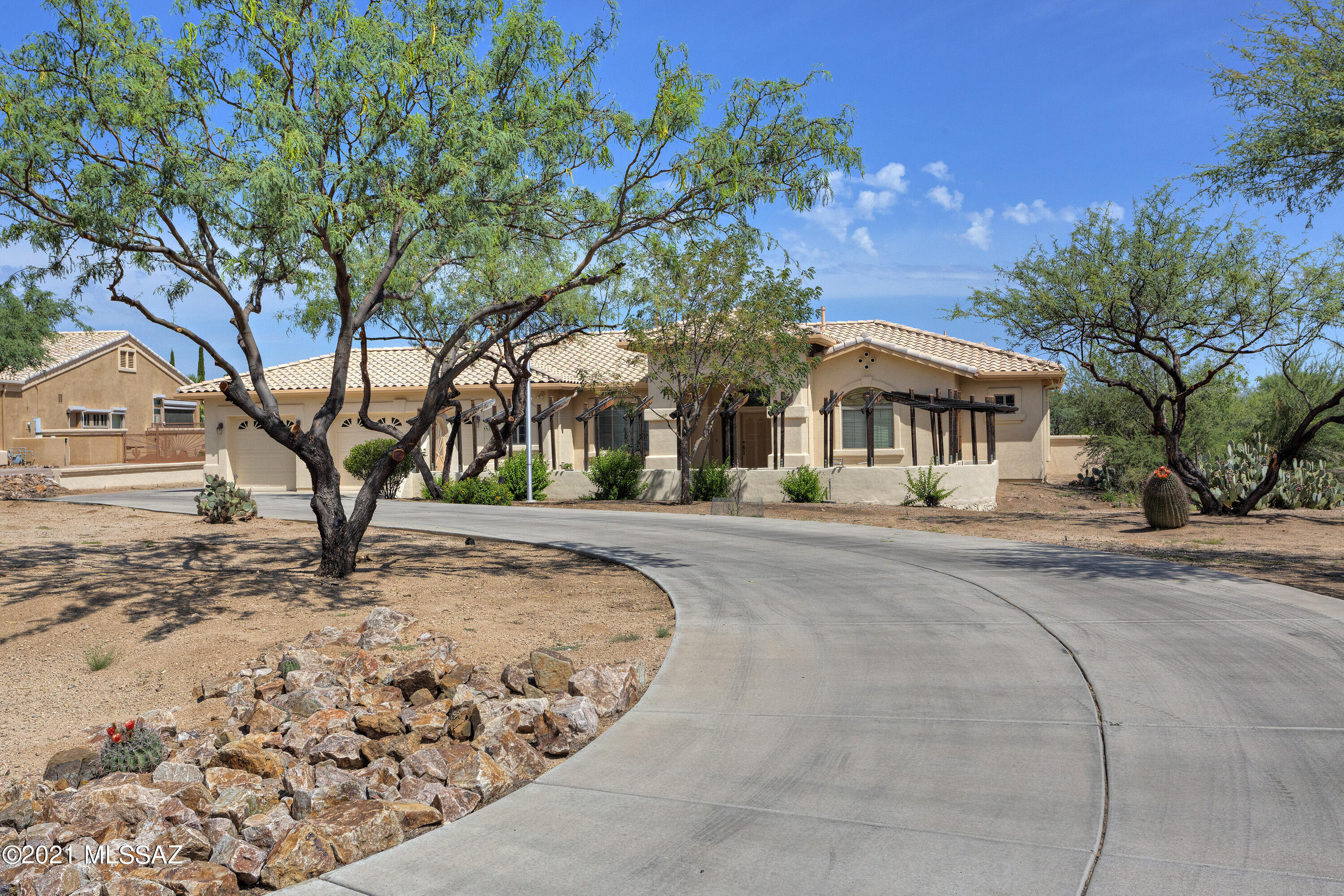 This is a dream property! On almost one acre, this custom designed home in a neighborhood with no HOA, features plenty of room with its 2,541+ sq. ft., 4 bedrooms, 3 baths, a separate dining area, living room/library, kitchen with family room, gas fireplace, 3 car attached garage and a huge separate RV garage (29'x55') with a 12' wide loft plus 3 workbenches making it the perfect workshop, and it has plenty of storage shelves. Plus, there's a 60 gallon air compressor. On the East side there is a 12'x55' covered patio. You'll love the front courtyard and built-in irrigated planter for flowering plants to attract birds and butterflies! The gourmet kitchen has a granite island, backsplash, gas range, 42'' maple cabinets, and recessed lighting. There are hi ceilings, fans and hardwood floors!