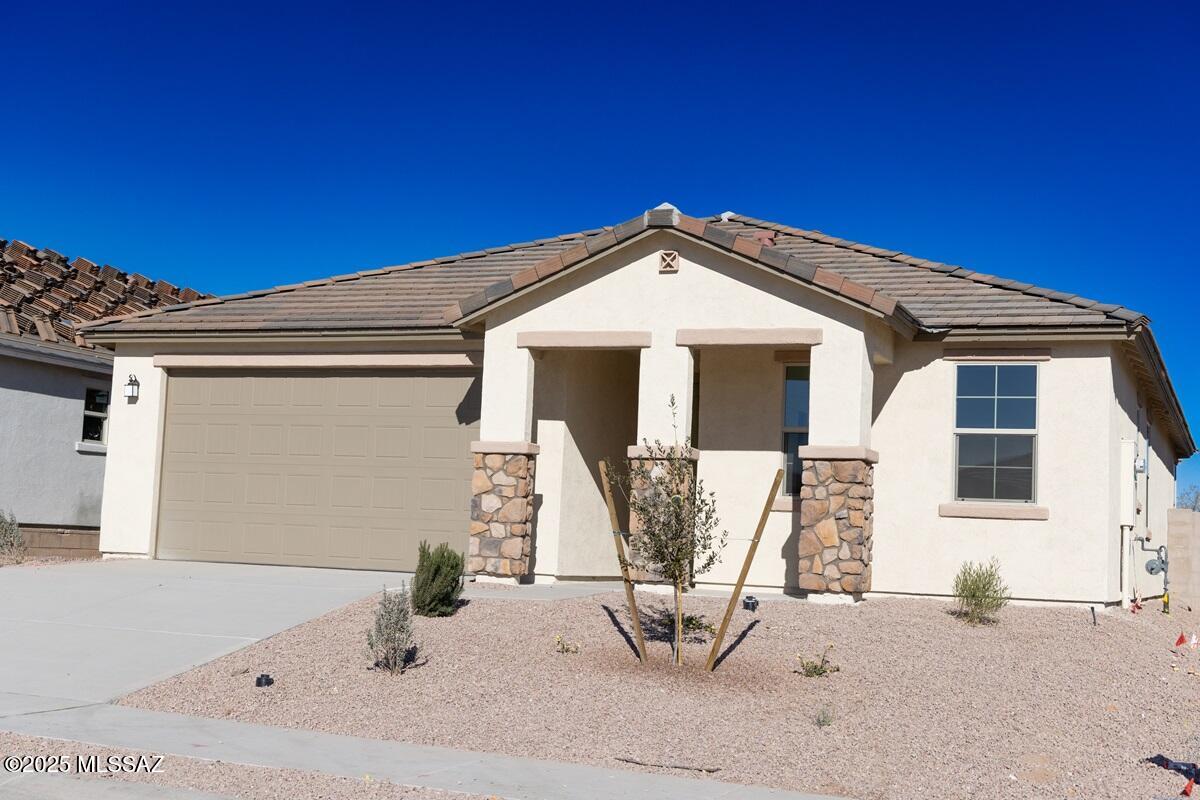 This popular single-story home features 9-ft. ceilings and 18x18'' ceramic tile throughout the home. The kitchen showcases 42'' cabinets, granite countertops, an island, pantry, and Whirlpool® appliances. Relax in the primary suite, which boasts a walk-in closet and connected bath with a dual sink vanity and walk-in shower. The oversized covered back patio provides space for unwinding and entertaining. Price includes discount predicated on using seller's preferred lender KBHS.