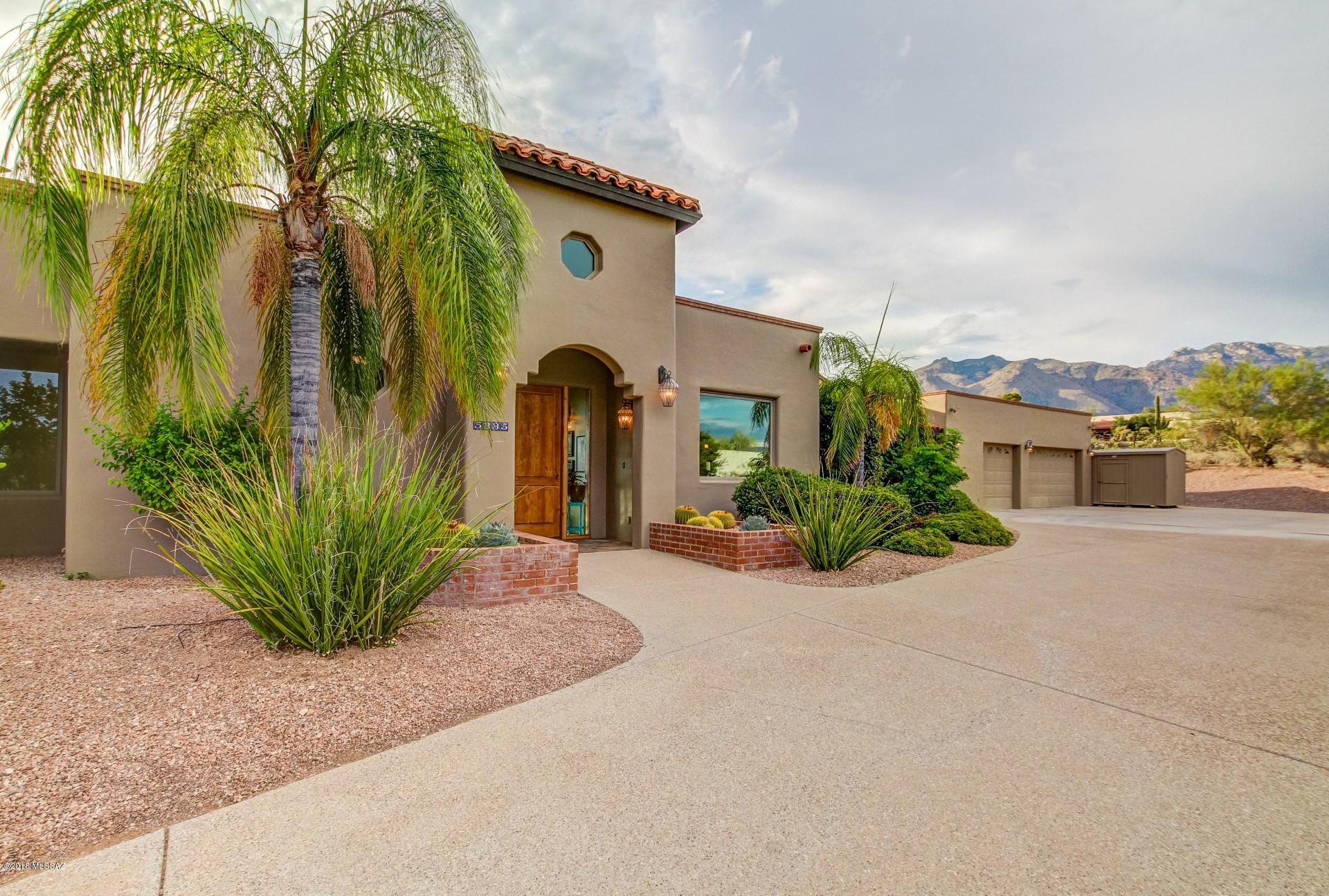 VIEWS that will instantly captivate, this property offers Tucson Lifestyle at it's best. The stunning Foothills home sits atop a private 1.78 acres and boasts unobstructed city and mountain views. Feel at home as you walk inside with plenty of natural light flowing throughout the homes open and airy layout. Enjoy gatherings in the ''Heart of the Home'' great room graced by a gas fireplace, exposed wood beams and glass sliding doors that lead out to rear patio. Gourmet kitchen will inspire your inner chef w/ granite countertops, newer high end SS appliances, wine fridge and butler's pantry. Master suite features a cozy fireplace, Jacuzzi tub, and walk-in shower. Family friendly floor-plan offers 4 additional bedrooms w/ walk-in closets, Jack & Jill bathrooms plus separate office w/ built in Entertain your guests in backyard oasis complete with sparkling pool, built in BBQ and fridge, outside surround sound, full length covered patio and sunsets that will leave you speechless. Huge 3 car garage with plenty of space for vehicles, storage or a workshop. So much to offer, plus no HOA!!