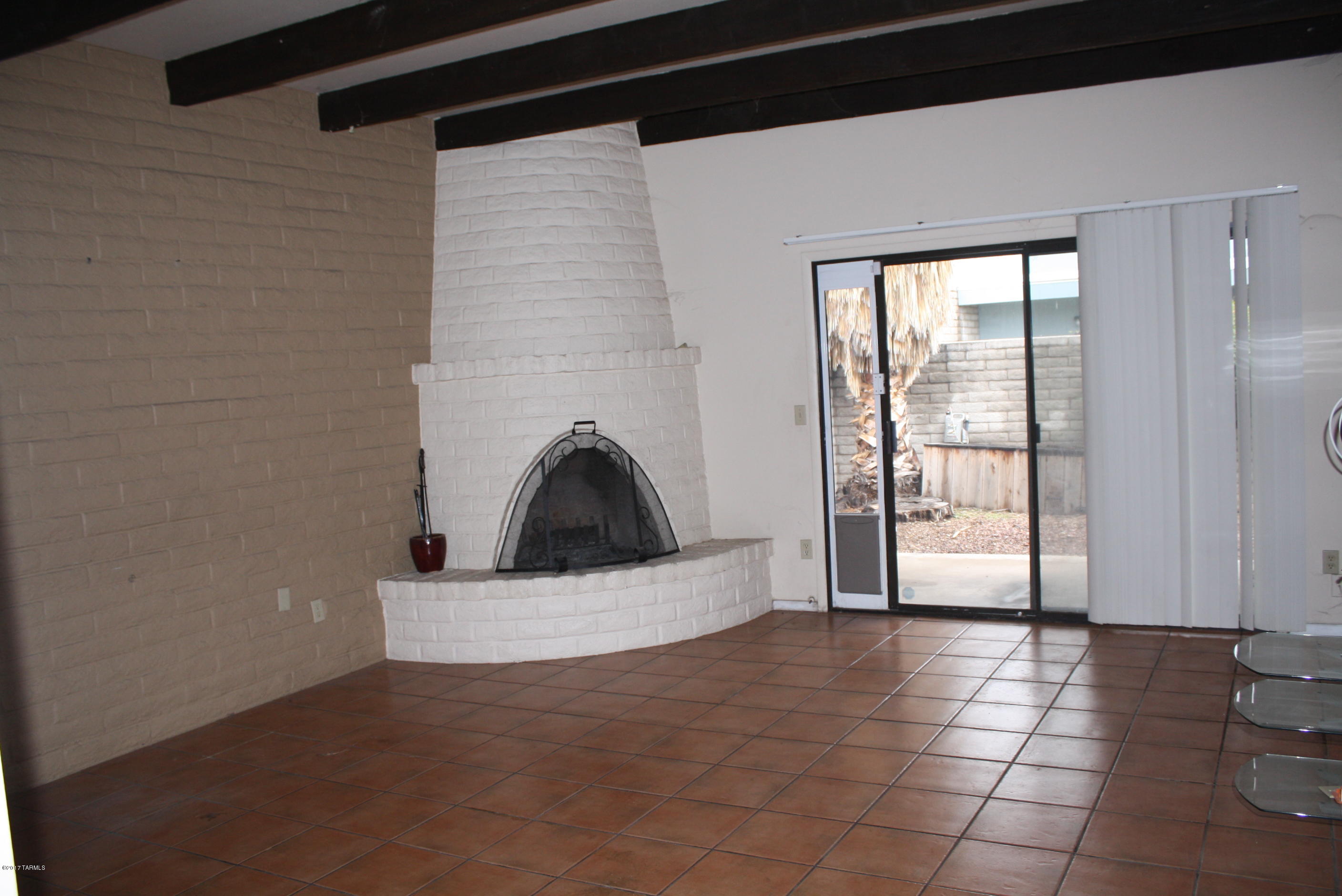 Affordable townhome in a smnall quiet neighborhood in the central part of town. Water, sewer and trash included in HOA.Very private townhome with two patios, fireplace, covered parking, skylights, block front patio!  Secured with wrought iron on both front and back. Beamed ceilings in living room. Eat in kitchen. Perfect for 1st time home buyers, & seasonal visitors.