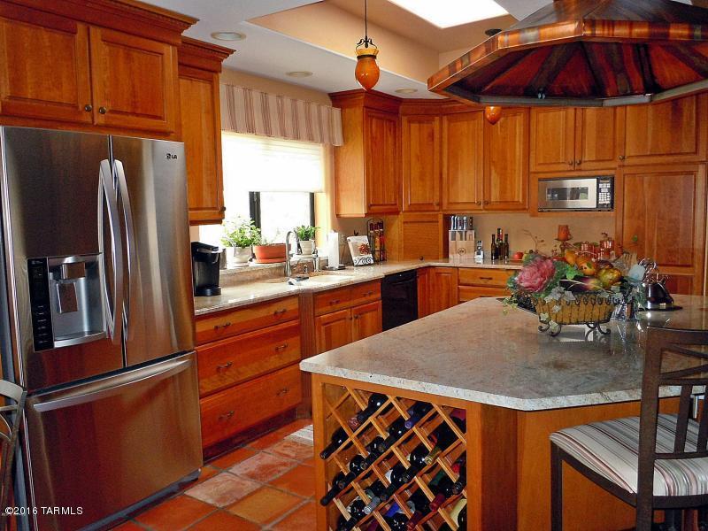 Beautifully remodeled, quality built, custom territorial in gated Redington Ranch, that features views from every room. High ceilings and many skylights make this home light and airy. A coffered ceiling in the dining room, beamed ceiling and fireplace in the family room are some of the many touches that make this home so special. Redington Ranch offers boarding stables, lighted tennis
court, a beautiful pond and clubhouse. Home is listed below market value, motivated sellers, submit your offers!