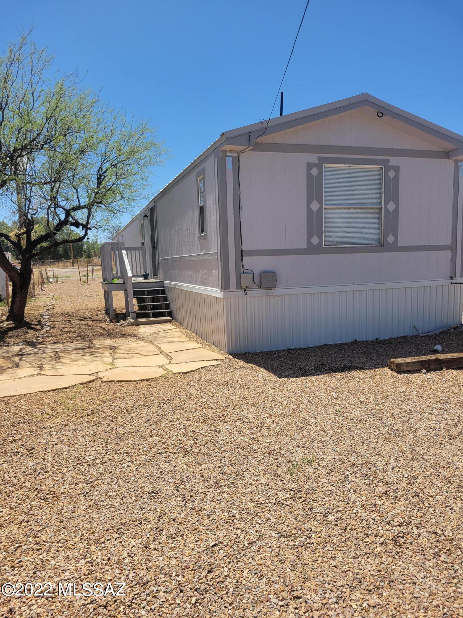 Remodeled 3 bedroom 2 bathroom home in town! Fenced yard, newer metal roof, was updated in 2020. Master bedroom has a large en suite bathroom with a walk through closet. Affixed 1995 Manufactured home with city services. Home comes with all appliances ready for new owners!