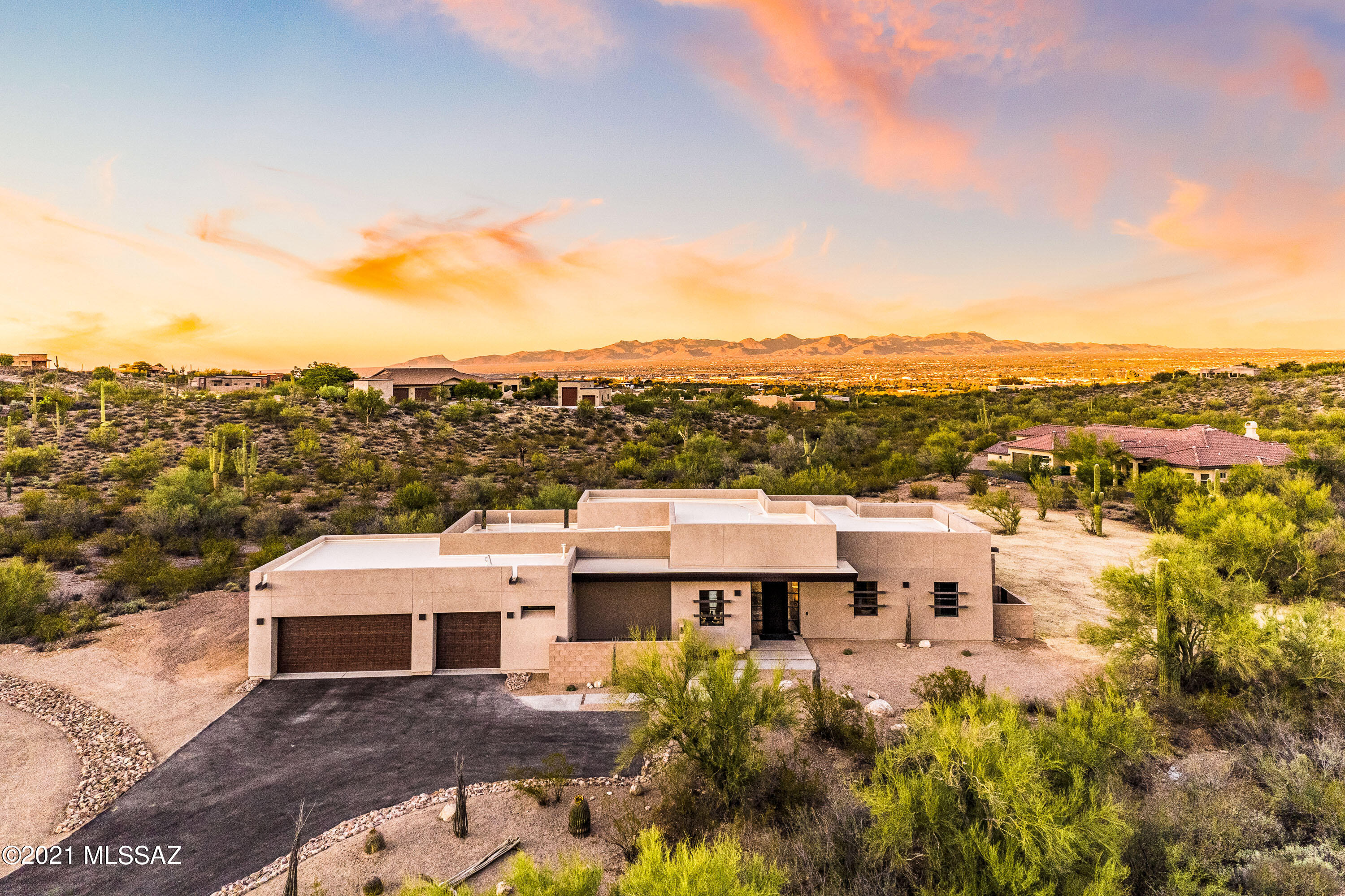 Fantastic CUSTOM home in prestigious Tucson Mountain Reserve.  Nested in a cul-d-sac with spectacular VIEWS of the city, mountains & sunrises.   Contemporary home offers OPEN concept yet provides a cozy look & feel.  DREAM Kitchen with island, SS appliances, GAS cooktop, walk in pantry & numerous cupboards.  Beverage station & built-in cooler.   3 Generous bedrooms, 3 Baths plus a DEN.  3-BAY garage with storage area. & room for cabinets.   Water-concious landscaping, natural desert vegetation.  Backyard fire-ring, minimal landscaping with room for a water feature, pool, outdoor dining &/or other amenities.  All of this on 3.32 acres surrounded by natural desert.  WONDERFUL neighborhood, GORGEOUS home & STUNNING location just minutes from the freeway, downtown & the U of A.