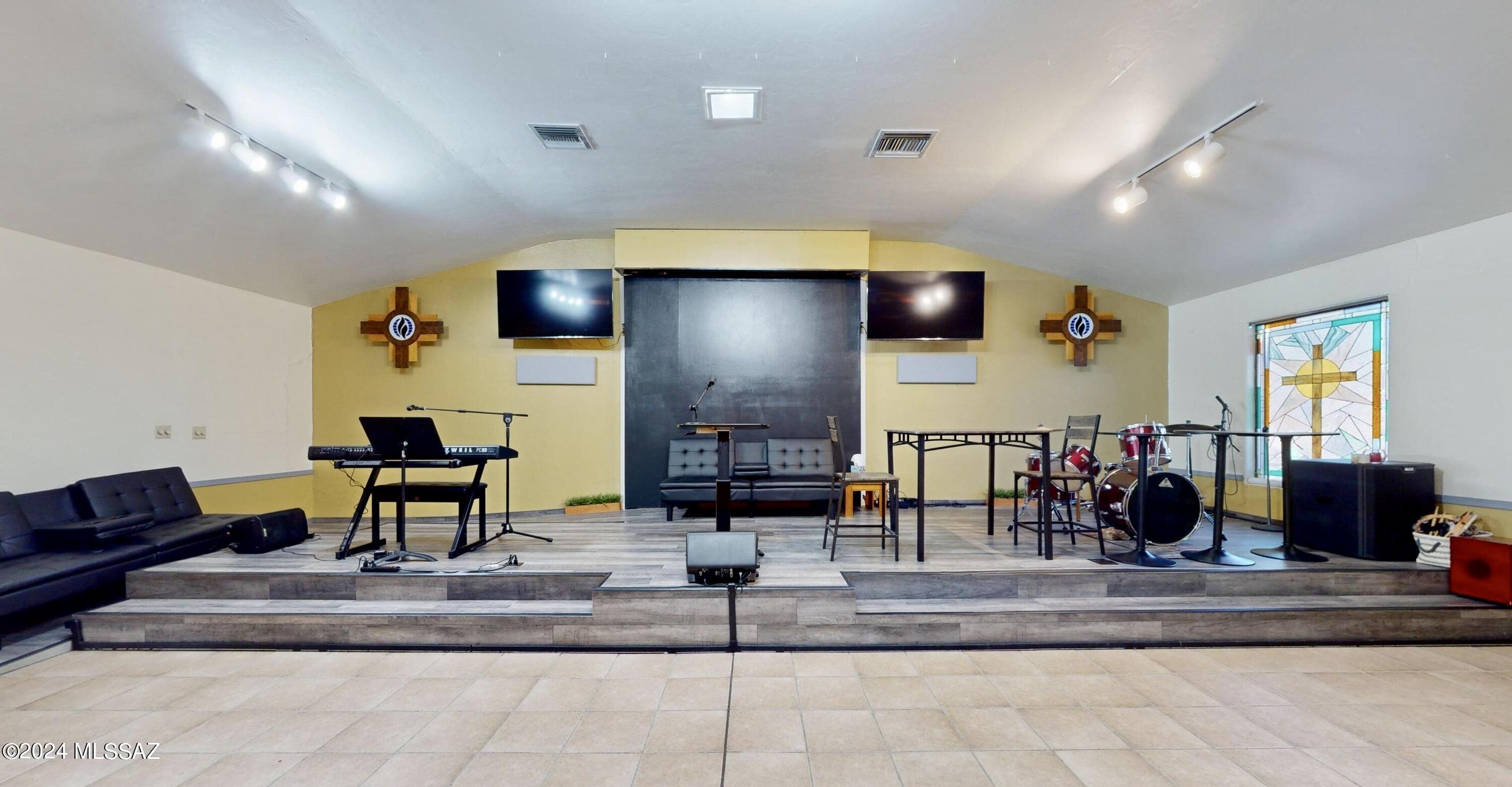 Fellowship and worship in this beautiful sanctuary. This 4151 sq. ft. Red Brick Sanctuary is conveniently located near the University of Arizona. Complete with beautiful stained glass this sanctuary offers a spacious worship hall, 3 office spaces, kitchen, 2 bathrooms storage room. Also included is a 1536 Sq. Ft. On site Residence