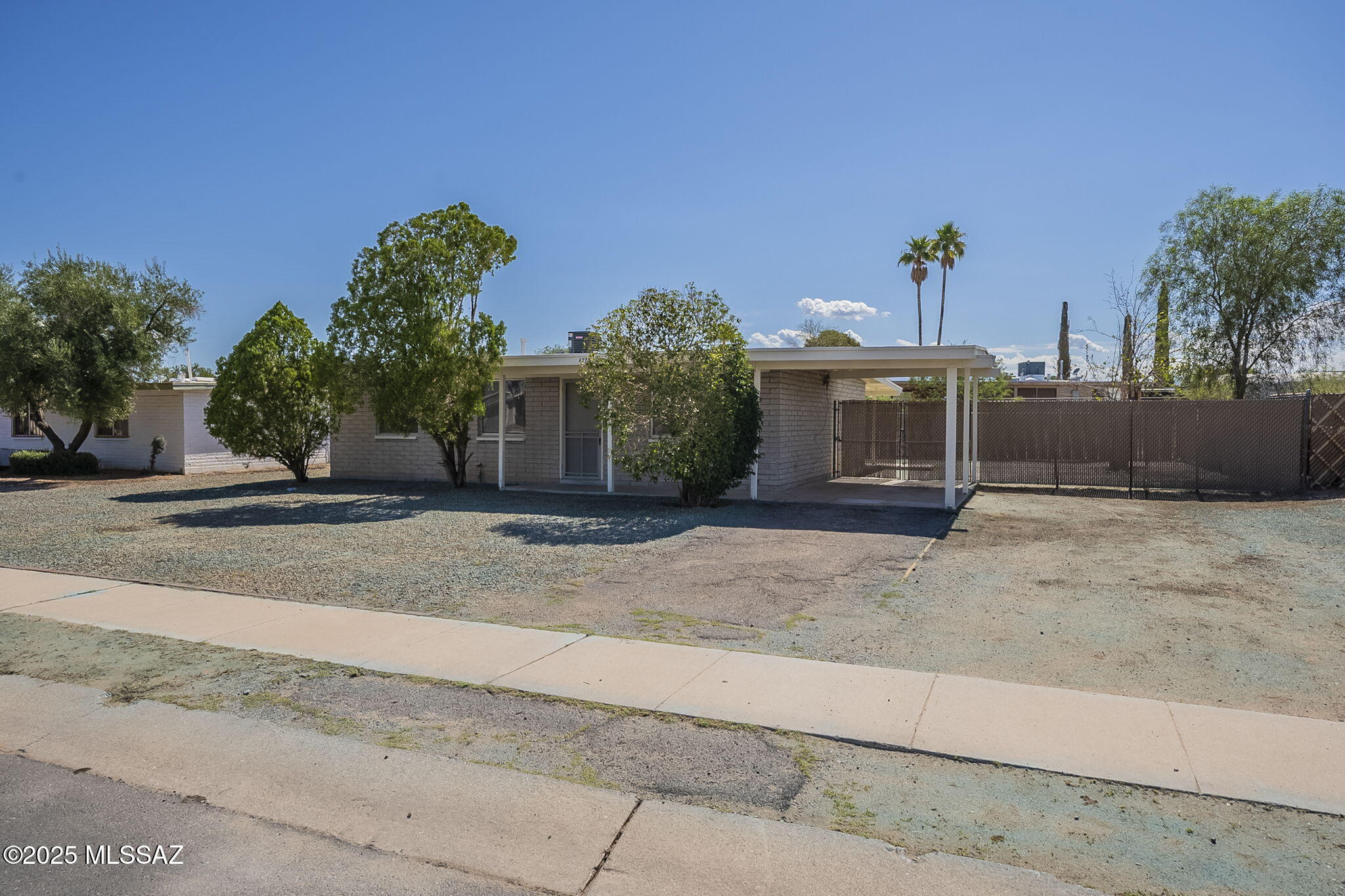 Live comfortably in this charming and well-maintained 3-bedroom rental home in Tucson's Eastside. With 1,002 sq ft of living space, this home features a cozy, functional kitchen, a bright living area, and a large fenced backyard perfect for pets or weekend lounging. Enjoy outdoor living under the covered patio, or practice your swing at the Fred Enke Golf Course just minutes away. The home includes a 1-car carport for convenient off-street parking. Pet-friendly for up to two cats or dogs, this property offers a quiet lifestyle in a well-established neighborhood with easy access to parks, shopping, and schools. Perfect for those seeking comfort, convenience, and affordability. Schedule your tour today, homes like this don't last long!