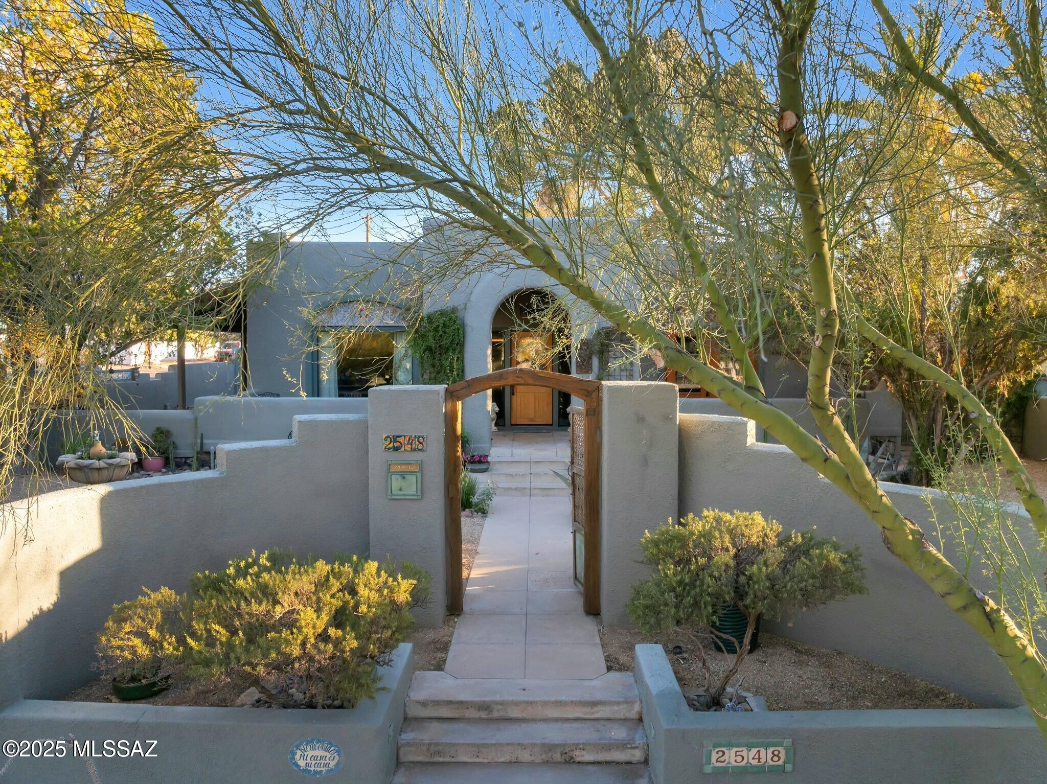 Enter your private courtyard to find this Exquisite Moorish Revival in Sam Hughes. Long time owners have carefully restored and renovated this distinctive property with an expansive Primary bedroom suite addition and detached Casita with private bath, laundry and kitchen. Main house boasts original wood and concrete floors, vaulted ceilings and countless historic features. Bonus space galore with sun room and finished basement with office and bedroom. The corner lot has mature landscaping with multiple covered porches and patios. Complete privacy with walled courtyard out front and block wall, gated back with enclosed carport. Large shed flex space for storage or home gym.  All of this in a beloved neighborhood with public parks, the U of A, shopping and local dining just minutes away!