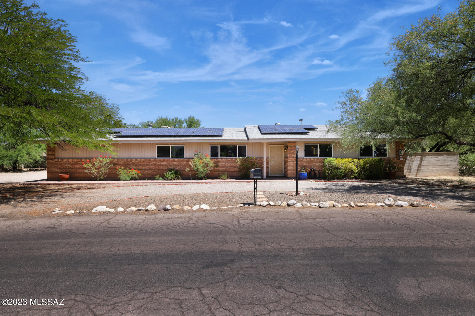 No HOA! Meticulously maintained home w/sports pool & solar. Eat in remodeled gourmet kitchen. New cabinets w/pullout drawers, 5 burner gas stove w/electrical hookup, stainless steel appliances, matching ceiling fans throughout. Both bathrooms remodeled w/water saving toilets. R40 insulation. Sliding glass door w/built in blinds. Energy saving windows throughout. 2 month old garage door with storage closet. Eaves are vinyl wrapped. Tile throughout except bedrooms. Wooden blinds, new base boards. Extra long covered patio. Roof replaced in 2015. Circle graveled front driveway. No shared back wall. Water harvest in backyard.