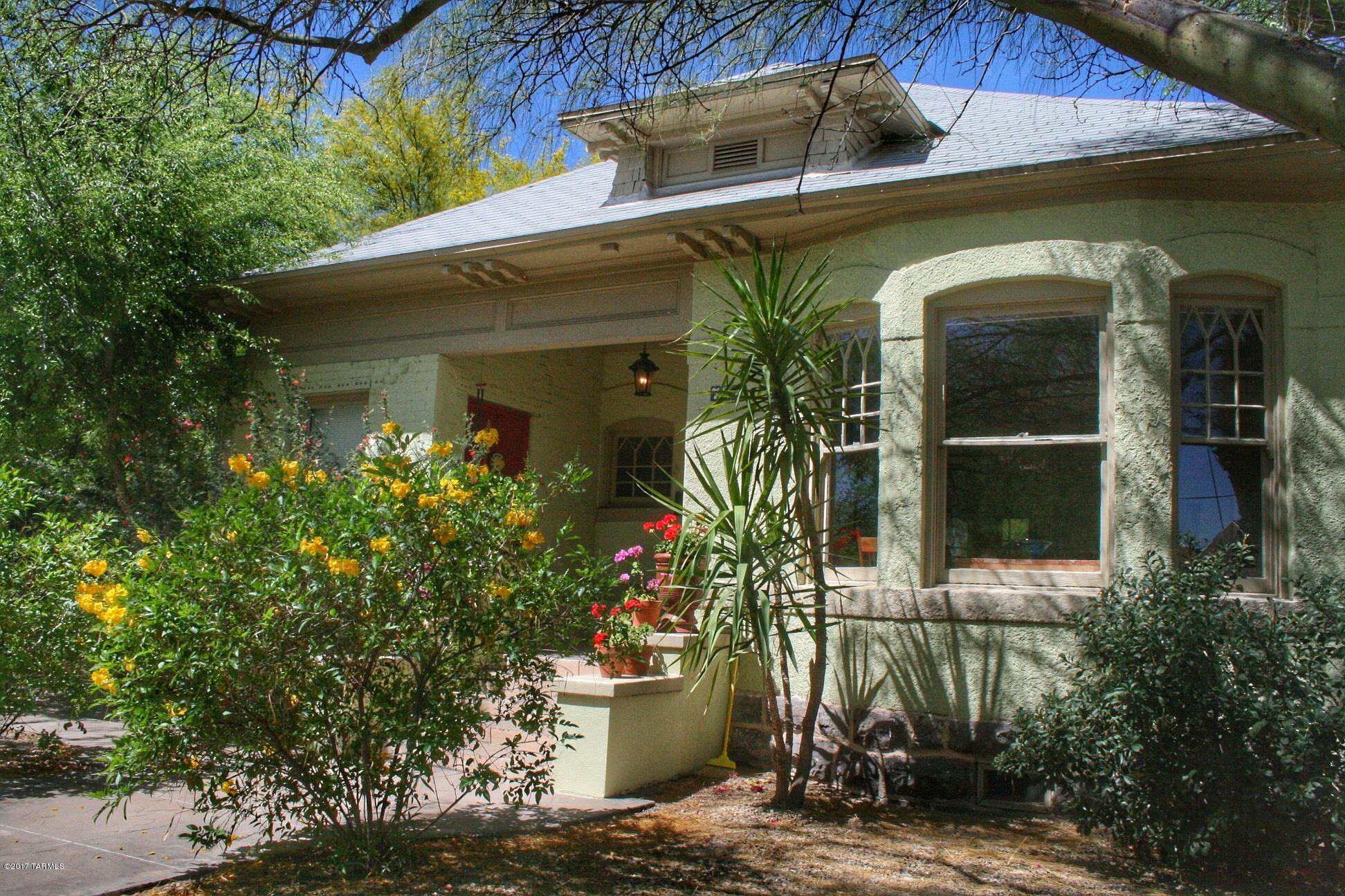 This stunning 1906 home has been tastefully remodeled throughout while retaining the original historic charm. The residence boasts over 2000 square feet of living space offering a formal living and dining room, 2 spacious bedrooms, 2 updated bathrooms, office space, a generously size family room, tons of closet space with multiple walk-in's including a huge pantry and separate laundry room. Special touches like the beautiful brick fireplace, remarkable maple flooring, soaring ceilings, huge windows and 2 car detached garage with metal doors add to it's unique appeal. This incredible home features a gorgeous and roomy kitchen, expansive deck, outdoor kitchen with grill, fruit trees, soft grass and tranquil fountain making this an entertainer's dream!