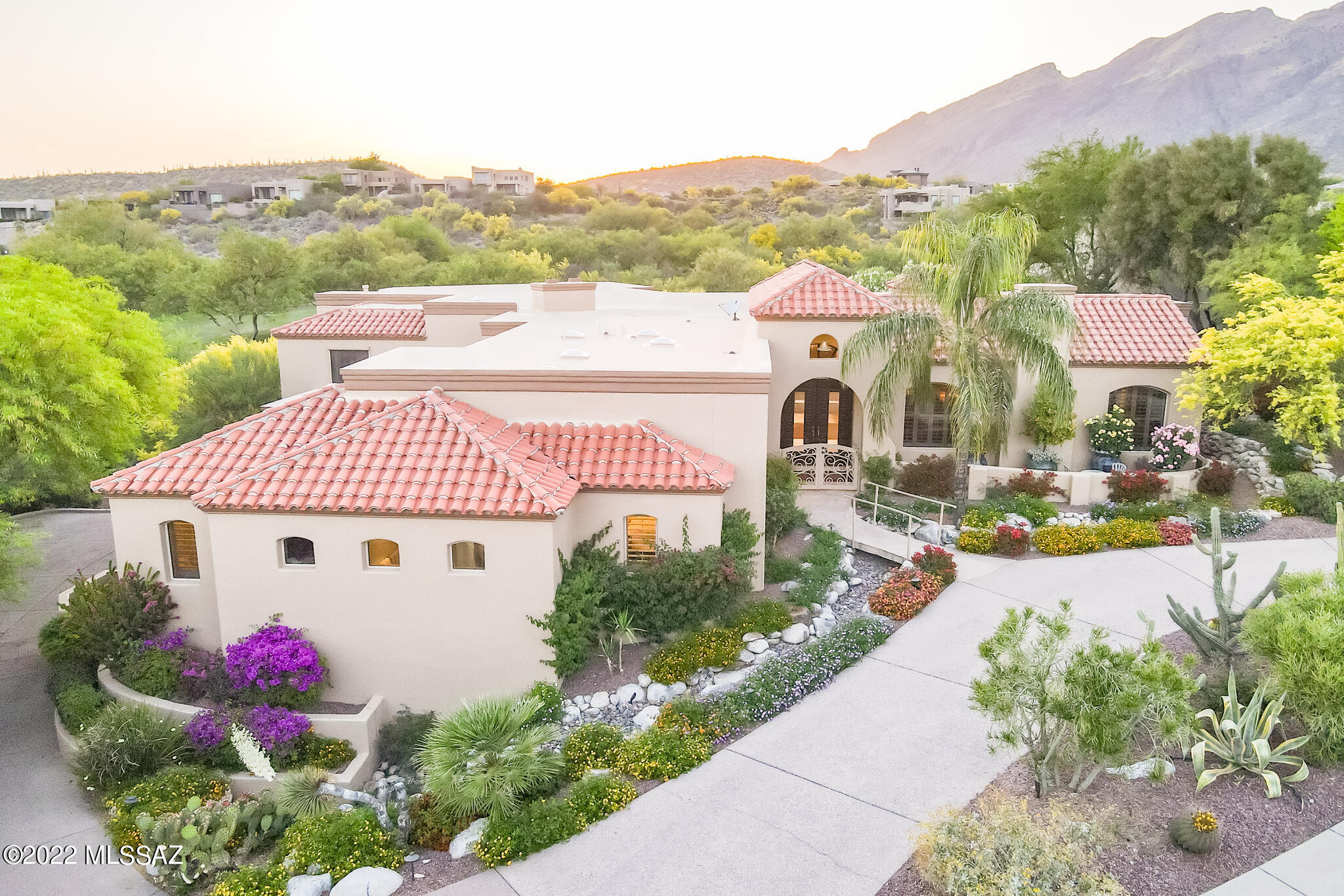 Stunning, Mission Style, Masonry Built, Custom Home in Guard Gated Ventana Canyon w/Mountain & Golf Course Views. Fine Features Include: Gallery Entry w/Beamed Cathedral Ceilings & Clerestory Windows. Verona Travertine Tile & Engineered Maple Wood Floors. Open Kitchen w/SS Appliances, & Breakfast Bar. Family Room w/Viga Beams, Bookshelves & Stained Glass Window. Formal Living Room w/Vaulted Ceiling's & Grand Fireplace. Spacious Master Suite w/ Fireplace, Indoor+Outdoor Rolling Shutters/Blinds, & Separate Office/Workout Room. Master Bath w/Granite Counters, Tub, & Glass Rain Shower. Cedar Lined Master Closet.Oversized 4+ Car Garage w/Epoxied Floors. Ultra Private Backyard w/Lush Landscape, Stone Work, Fire Pit, Citrus Trees, & Pebble Tec Pool & Spa w/Water Fall. Quiet Cul-de-Sac Location.