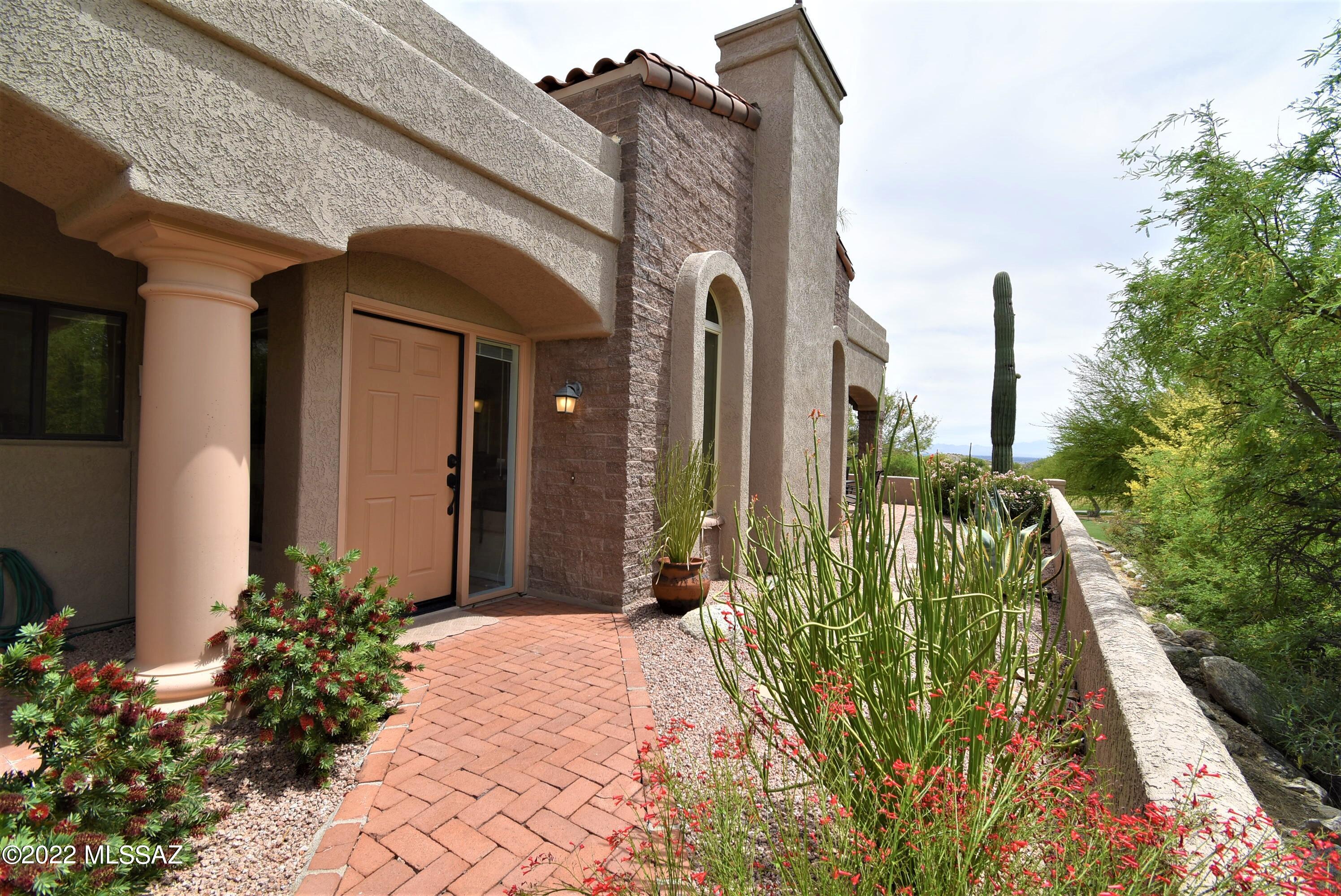 This stunning view house is located at the finest resort-style golfing communities of Ventana Canyon Country Club. This exquisite 2-bedroom, 2-bathroom plus den with 1838 SqFt has spectacular and exceptional Golf Course Views. The house is completely detached and it's a sought-after end unit. Upgrades include Saltillo floors, soaring beamed ceilings, view windows, stunning fireplace, lush courtyard entrance, and 2-covered patios. The backyard is extremely peaceful & private. Perfect for al fresco dining or simply soaking up the outstanding views.