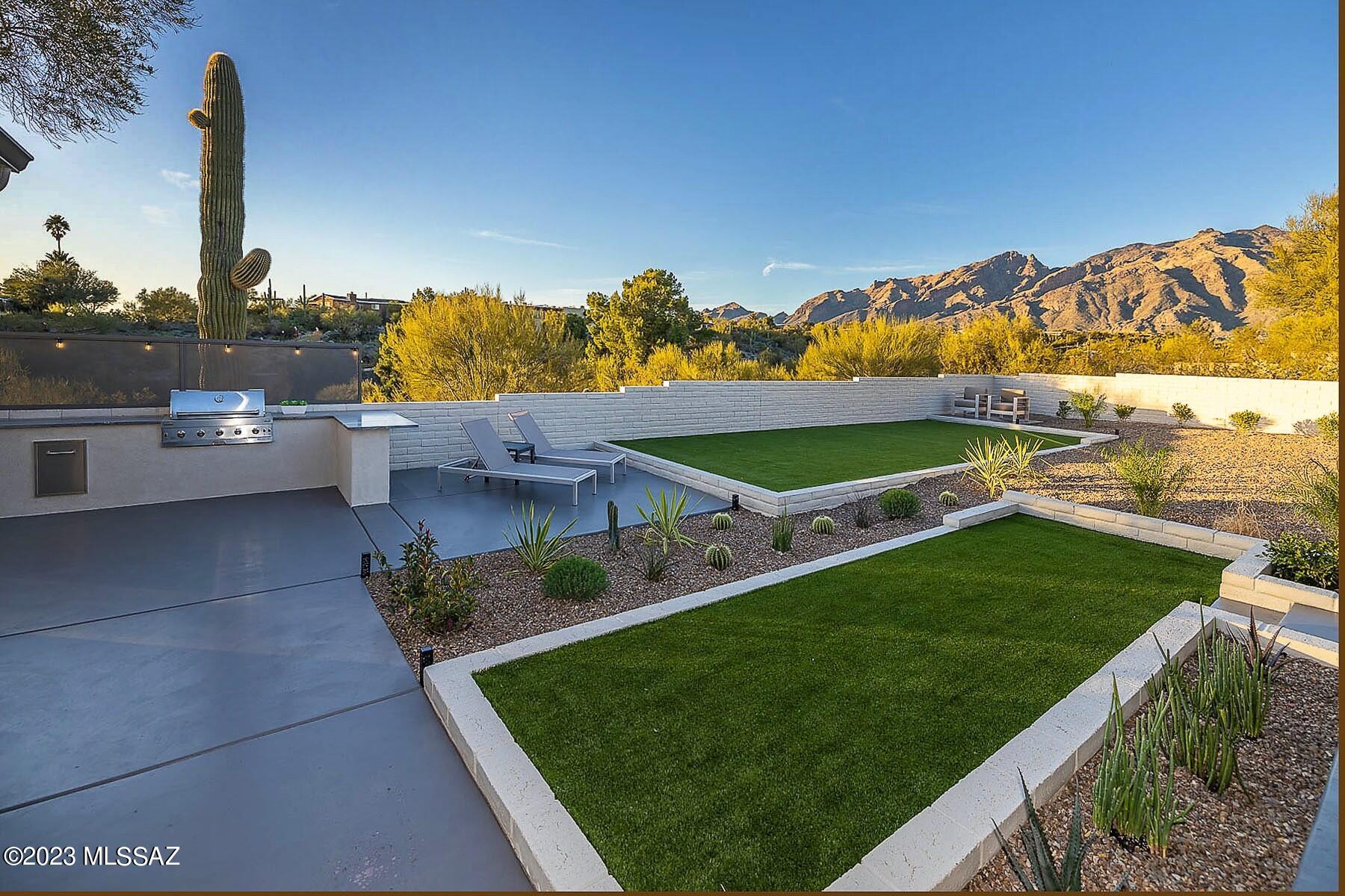 Spectacular Flecha Caida 'Ranch' Estate. With a nod to FC's Mid-Century roots, this property has recently undergone a mega-transformation. Spectacular Mountain Views from this sprawling 1.6 Acre property. All New: Under-slab Sewer Lines, Electrical, Plumbing, Lighting, Fixtures, Flooring, Kitchen, Bathrooms, Windows, Doors, Landscaping, Paver Driveways, Enclosed Garage, Expanded backyard, Irrigation System & Landscape. Elegant design w/ tasteful finishes: 24 x 48 Italian Tile floors, Bertazzoni Appliances, Custom Cabinetry w/ neutral Marble & Tile accents. Design promotes indoor/outdoor living w/ several inviting patios, large turf areas & Sunset inspired outdoor kitchen. Incredible Central Foothills location minutes from everything! District 16 Schools. Owner has AZ Real Estate License.