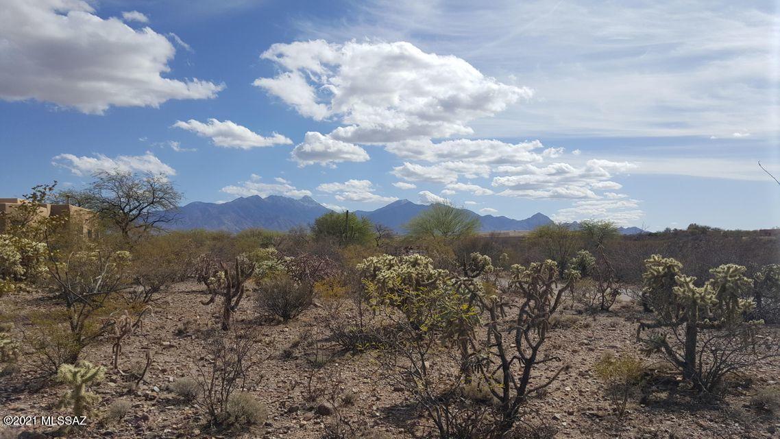 This is the place that sits deep in your heart.  Privacy, space, sunsets, sunrises,  mountain views.  Live a gentle elegant desert lifestyle.  Water, electric, gas, and sewer already on the site with a paved road all the way.  No extra expense to build.  A level homesite so land prep should be minimal.  
This may be the one....