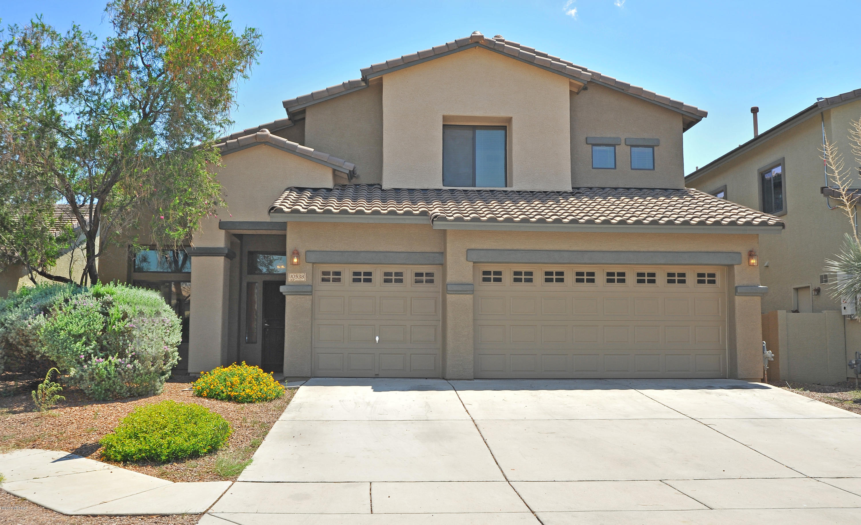 Beautiful well cared for home with brand new carpet, freshly painted interior and exterior.  Downstairs, you will find a large master suite with a luxurious bath. Eat in kitchen with island, custom cabinets and gas cooktop that leads to the large family room. Entertainers dream of a backyard with a full length covered patio, built in propane bbq by the pool that is surrounded with palm trees and a natural grass area, fully irrigated. 3 car garage with natural light and custom built ins for ample storage.  Community amenities nearby include pool and spa, playgrounds, ramadas, basketball courts, walking paths, and fields. In the Vail School District!