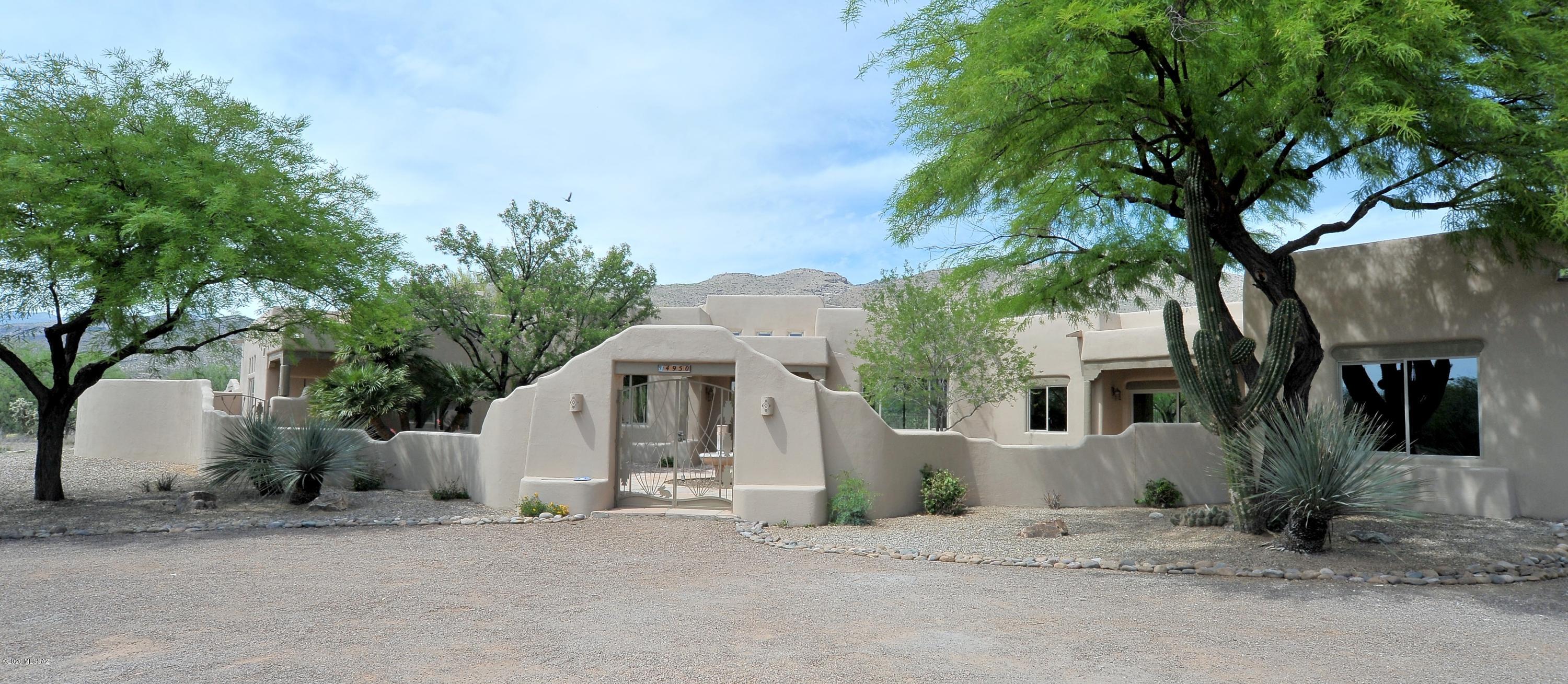 Beautiful 4 Bed, 4 Bath home on 3.3 A in quiet corner of Tanque Verde Valley. Split plan includes guest en suite w/ private entry.Spacious entry courtyard & fountain.Breathtaking,expansive 180 degree views from nearly every room! Huge windows bring mountains & desert inside.Multiple patios & outdoor spaces for entertaining.Gracious master suite w/ gas fireplace & attached study/sitting area.Formal living & dining.Separate office/den.New granite & quartz countertops, travertine showers & baths, completely updated.Kitchen & bath cabinets refinished. Brand-new stainless appliances.New water heaters. Moreno saltillo, wood flooring & new carpet thrghout. Pool, Spa, Kiva FP w/ bancos & putting green. Sports Court.Gigantic RV garage w/ 220 amp svc.Full list of recent improvements available
