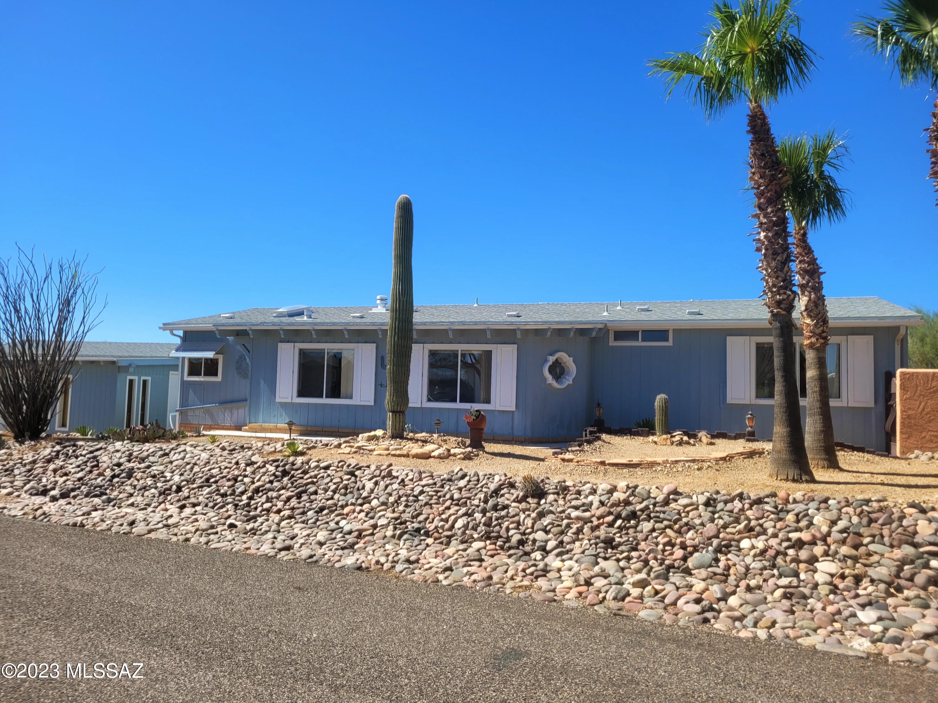 Breathtaking Mountain Views from the gorgeous rear porch. Pass through the courtyard with a peaceful fountain towards the 2 Car Plus Garage with extra shop or hobby space. New HVAC installed in 2019. High ceilings in Living Room equipped with a gas fireplace. 2 bedrooms plus office/den. Primary Bath has split dual vanities. Swimming Pool, Spa, Tennis Courts, and Hiking Trails.